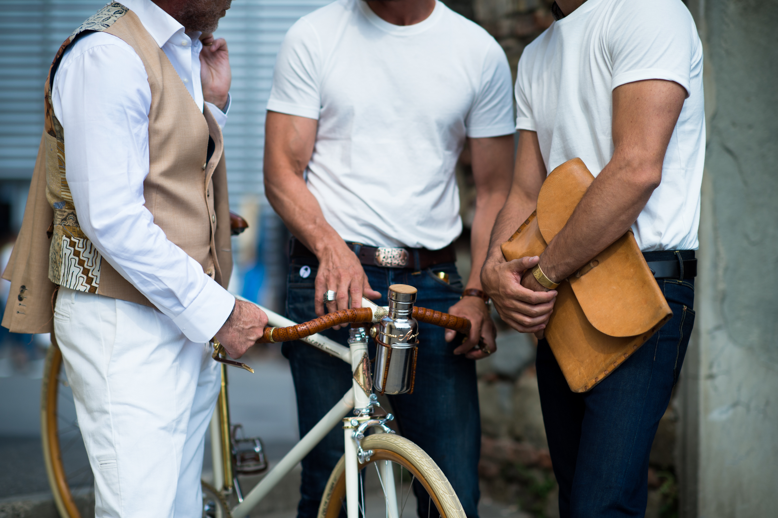 Three men wearing white shirts