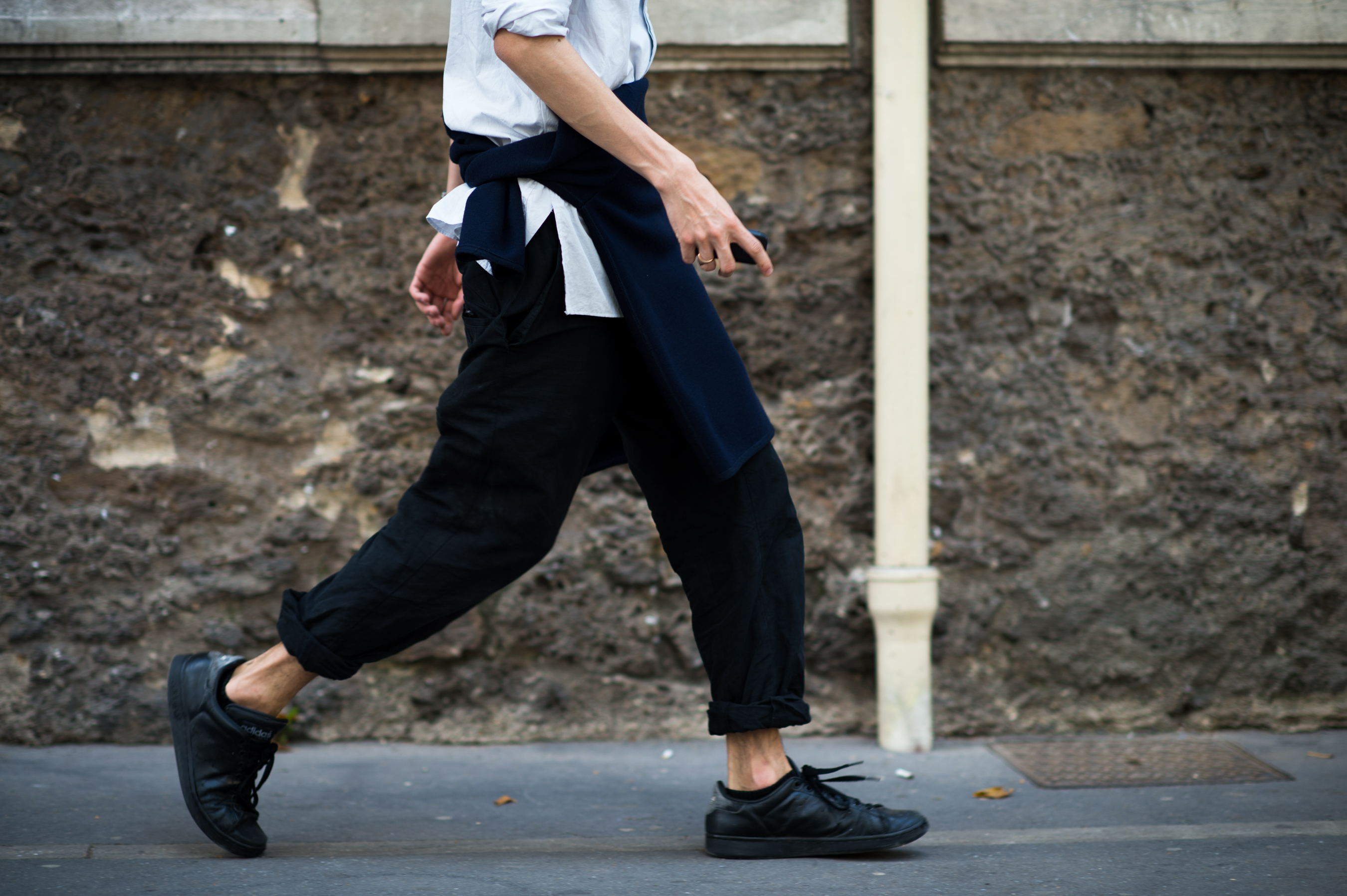 Man with his jumper tied around his waist