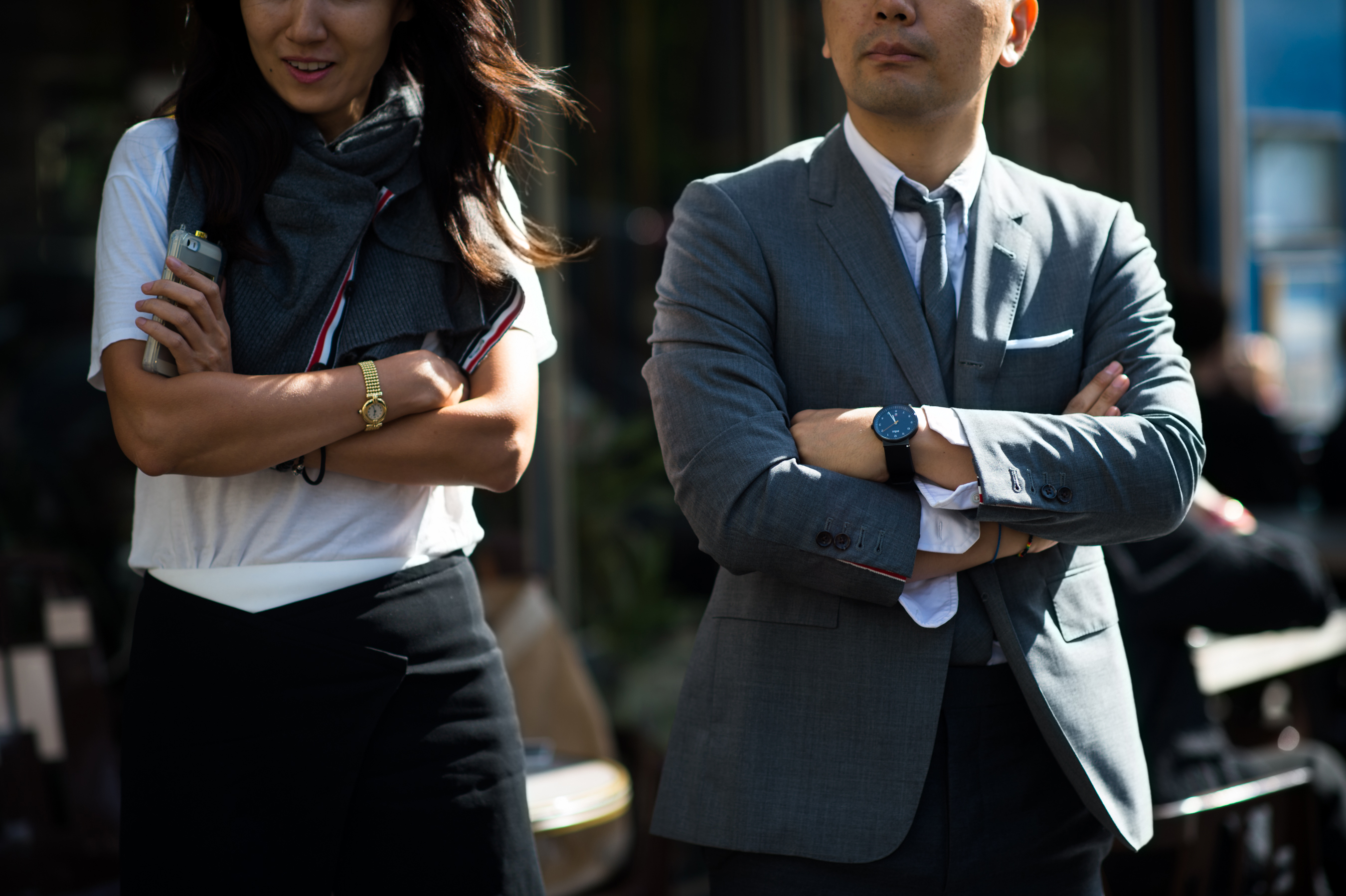Man and woman wearing grey suits