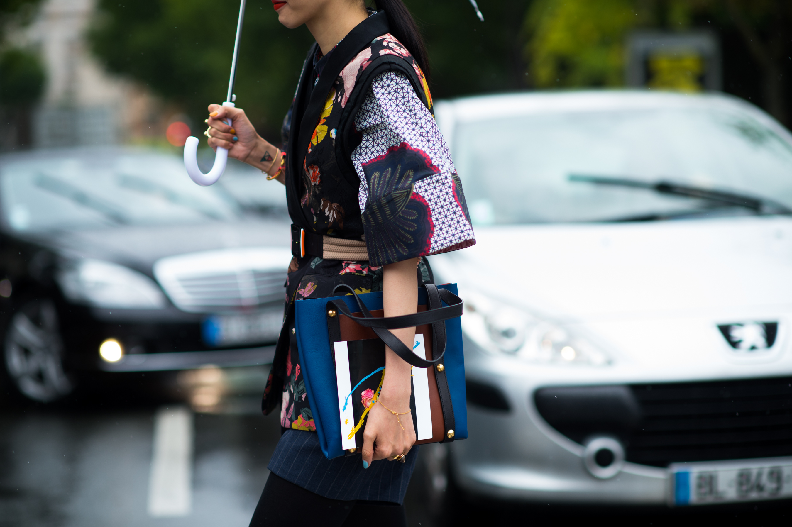 Asian woman wearing a colourful top