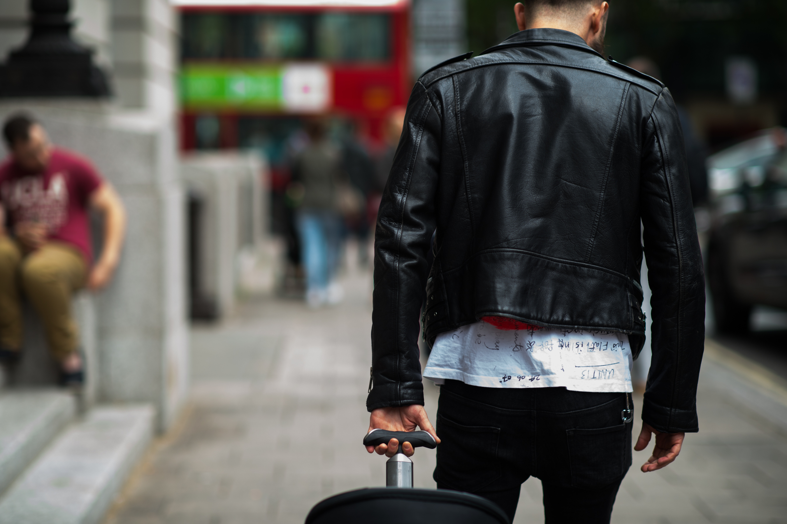 Man wearing a T Shirt with writing on it