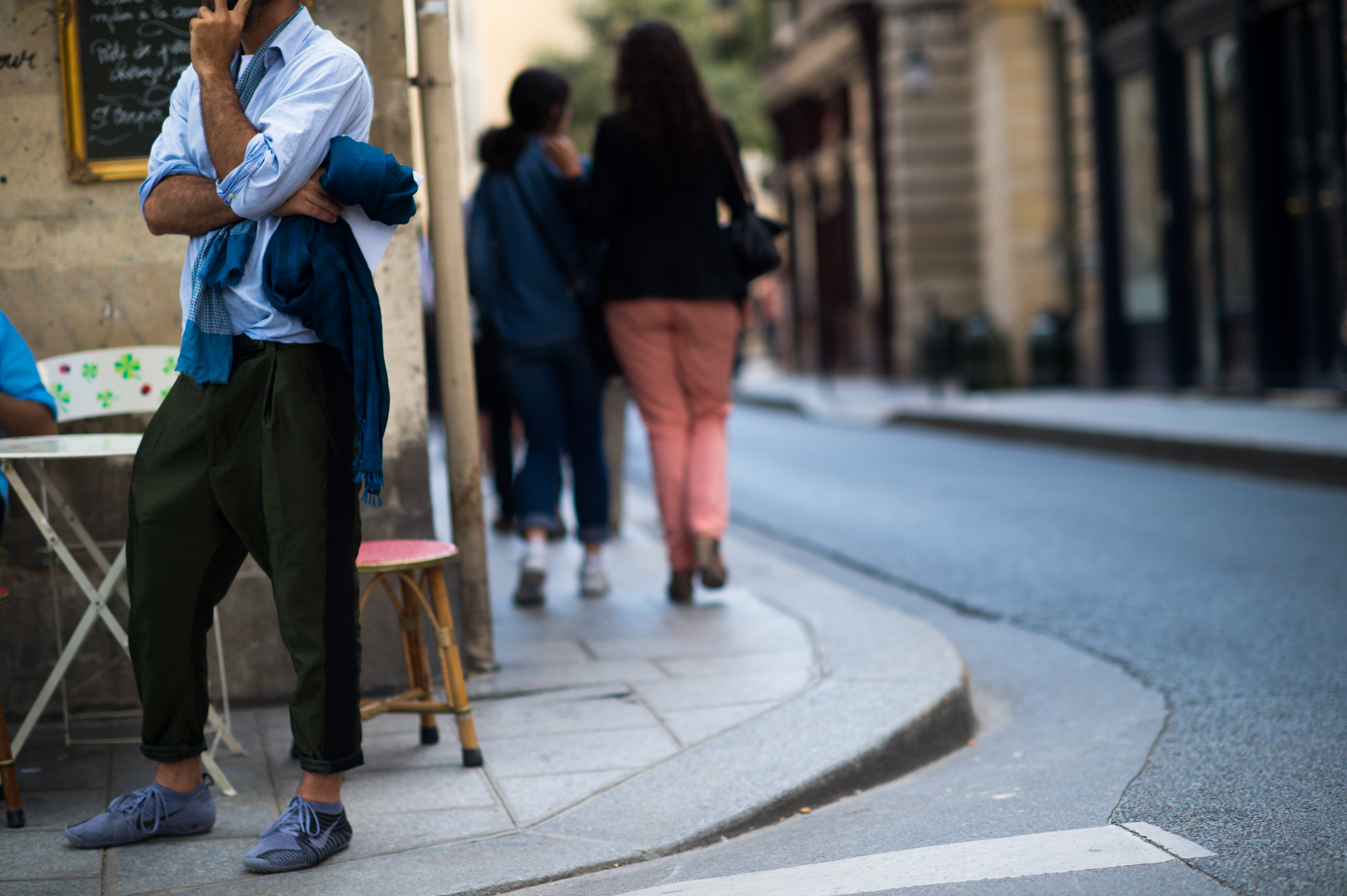 Man wearing green pants with Nikes