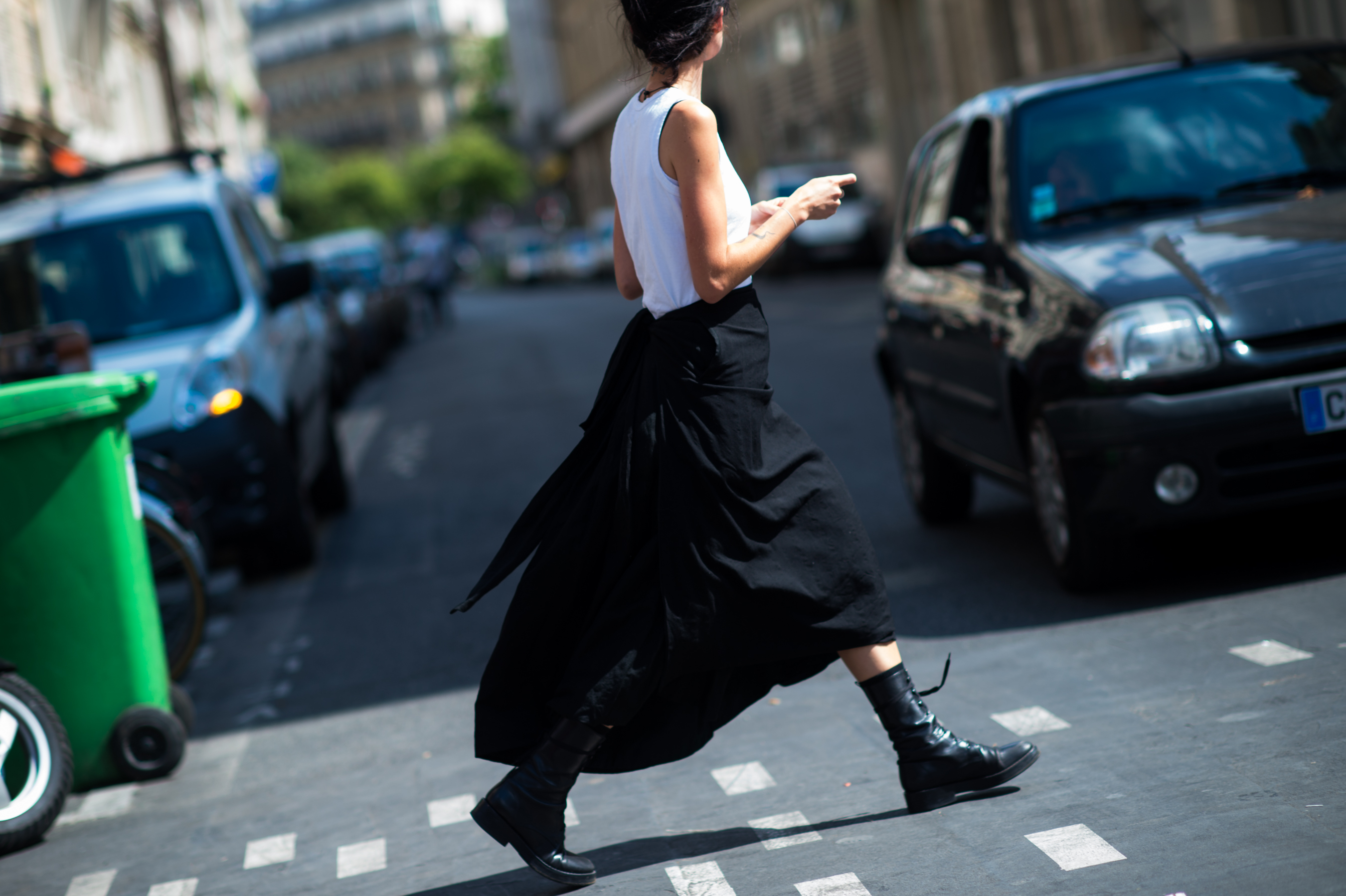 Girl wearing a white top and black skirt