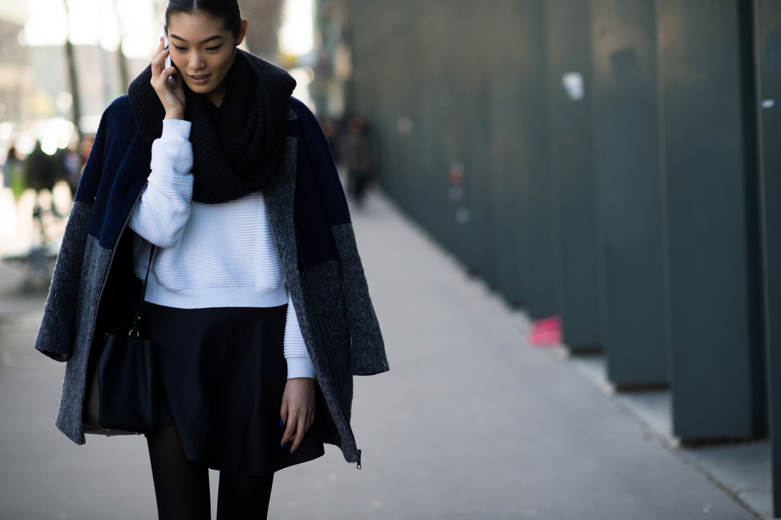 Japanese model wearing a blue coat