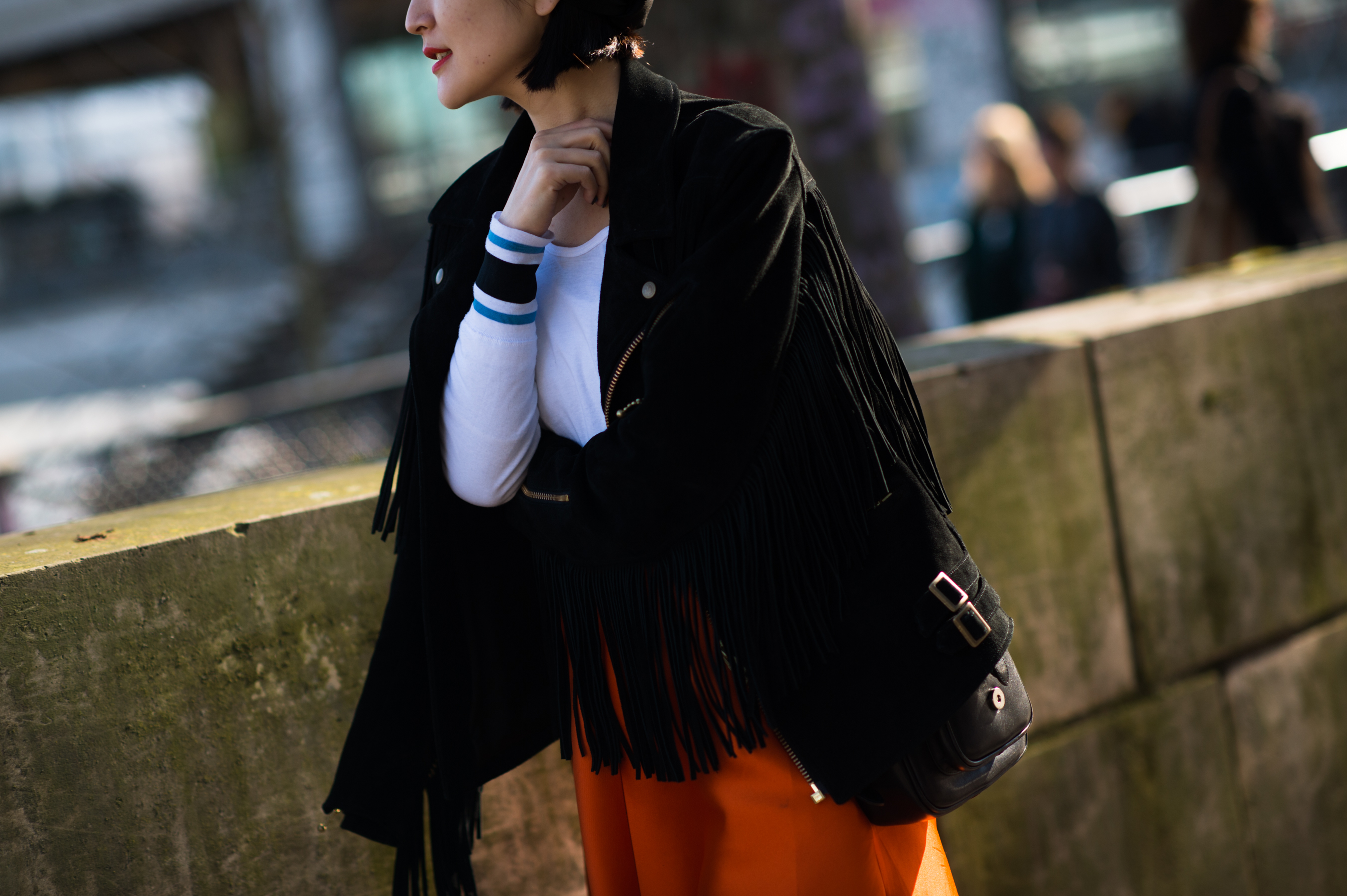 Asian woman wearing a varsity sweater