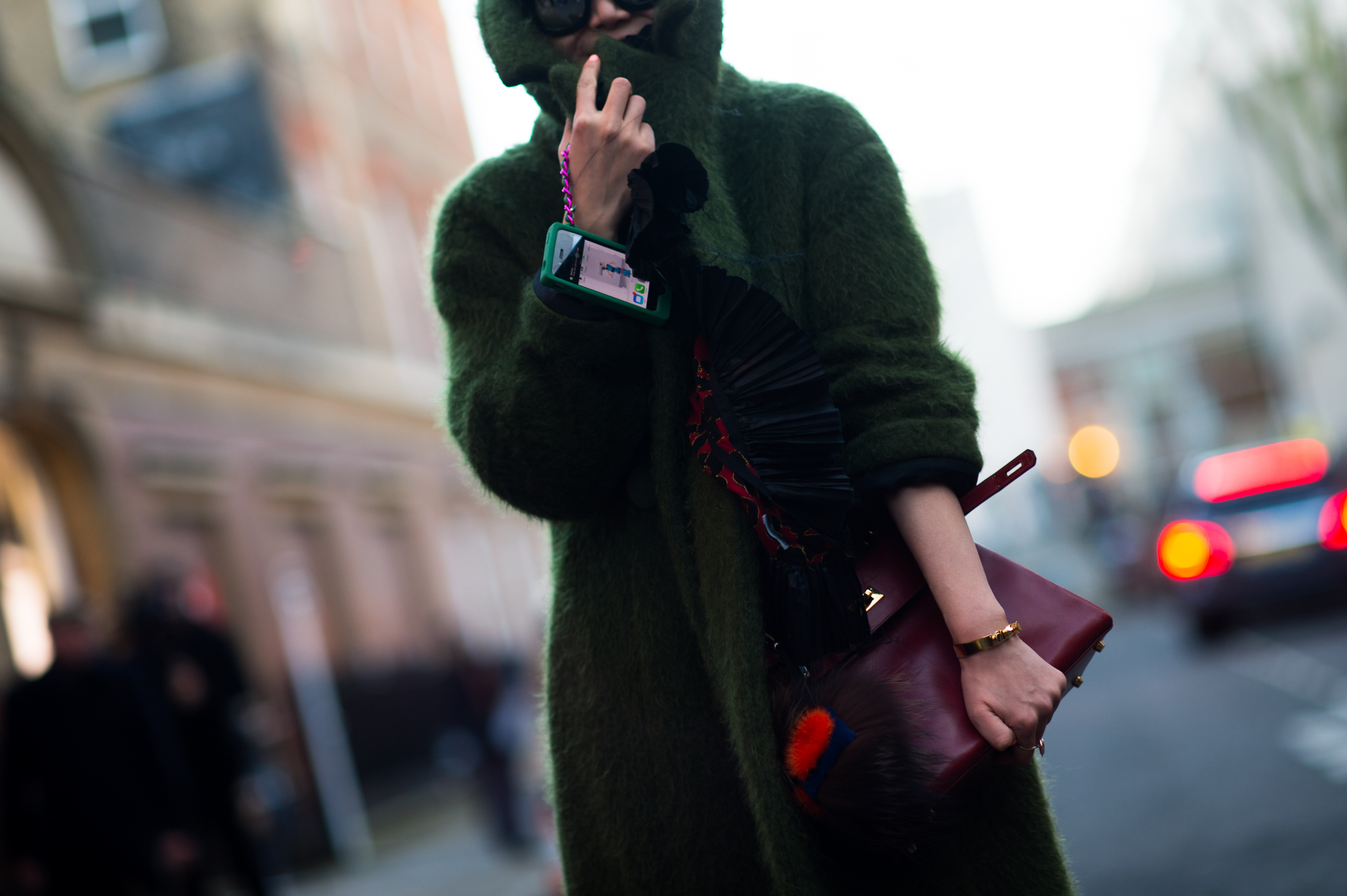 Chinese Elle editor wearing a green coat