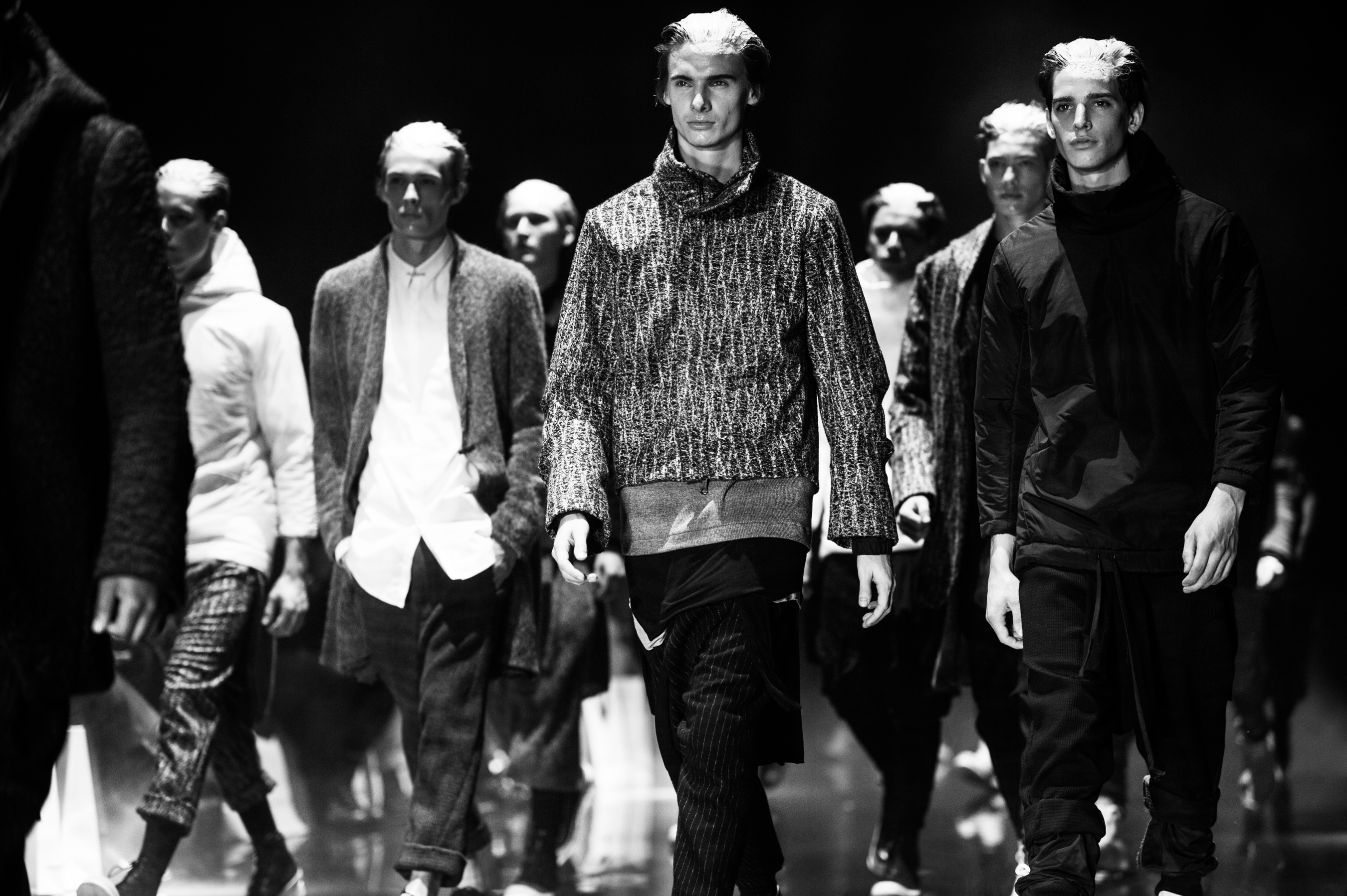 Male models walking fashion show runway