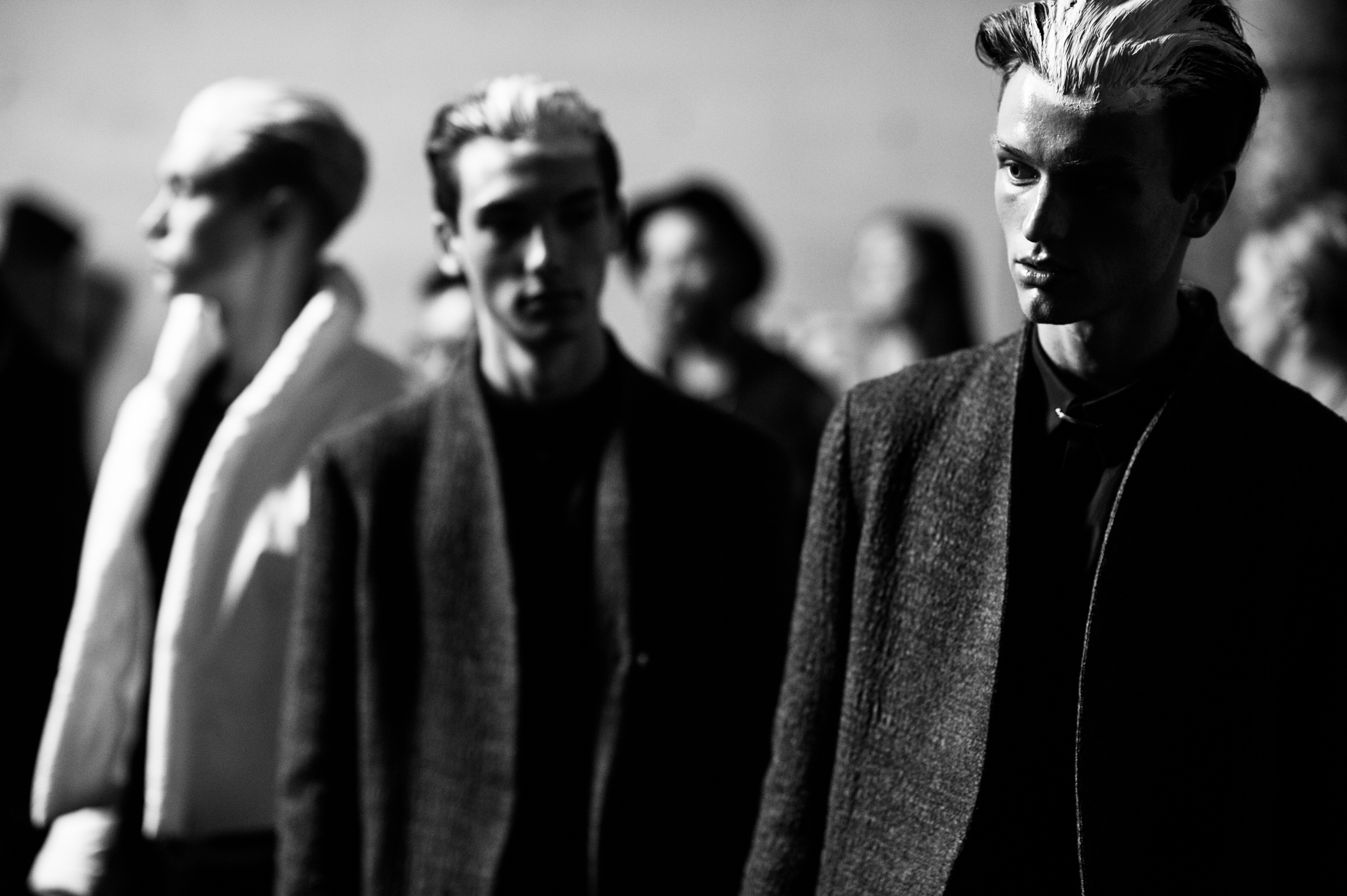 Male models before a fashion show