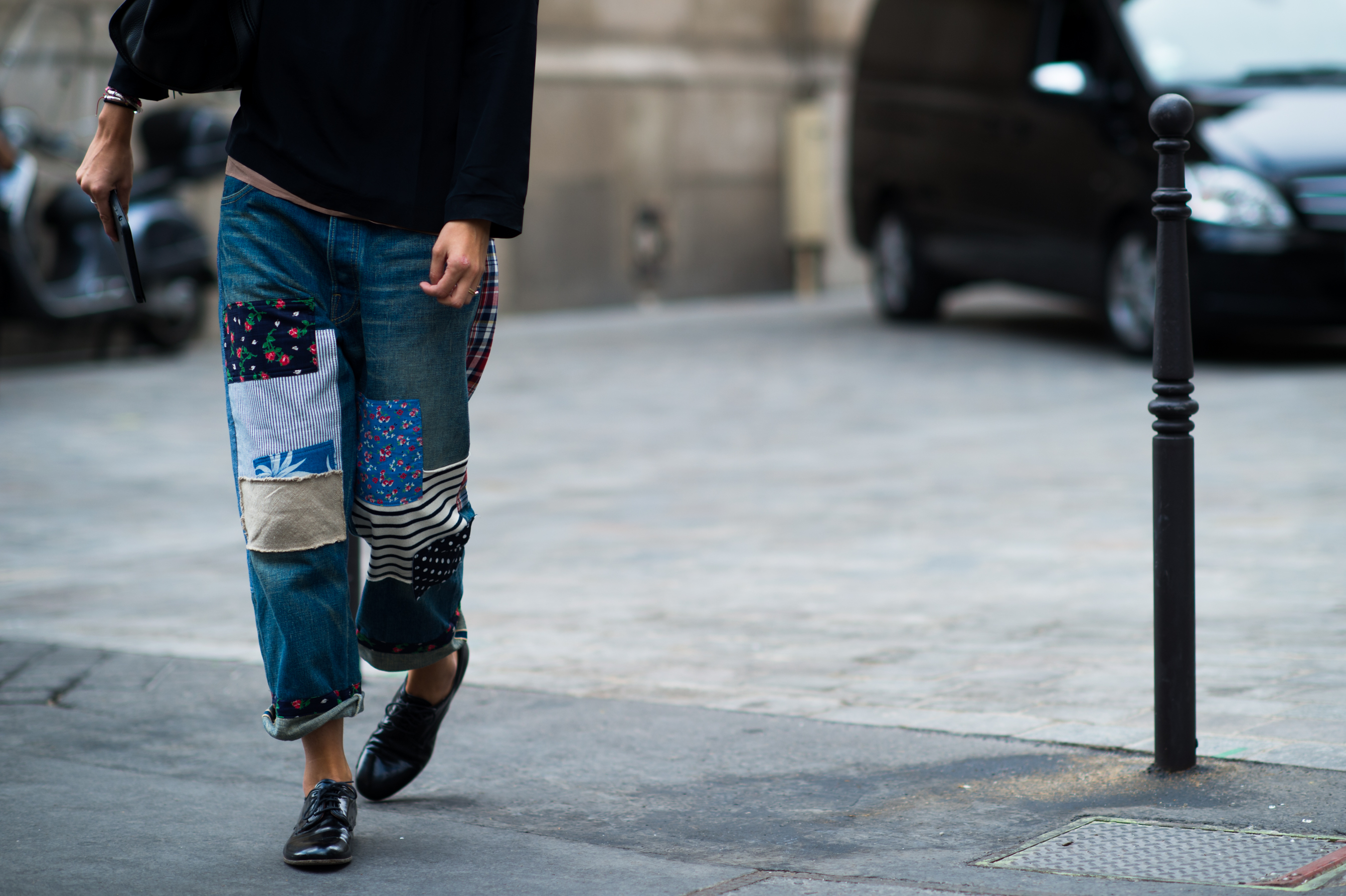 Woman wearing patchwork denim jeans