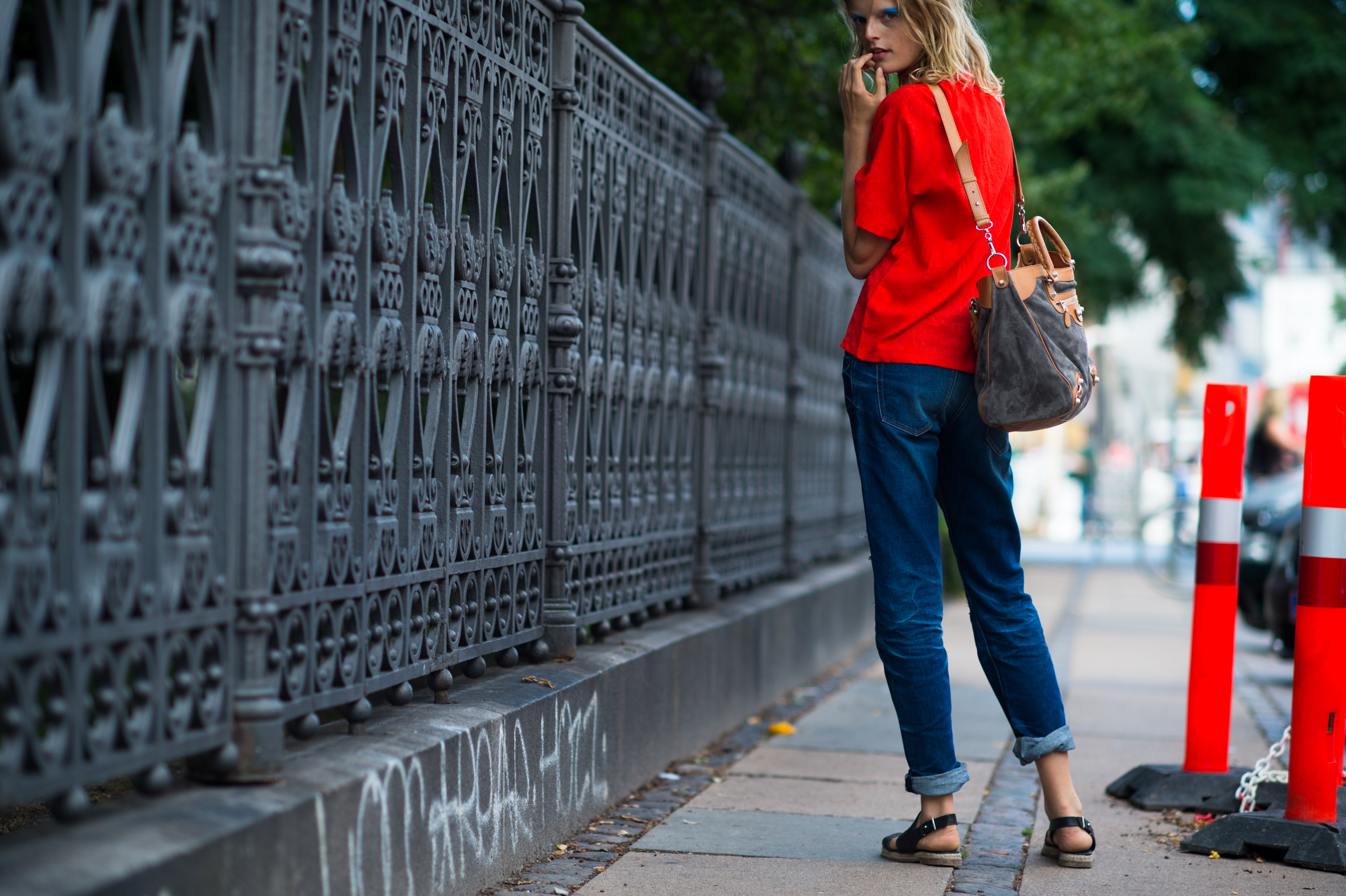 Belgian model wearing orange and denim