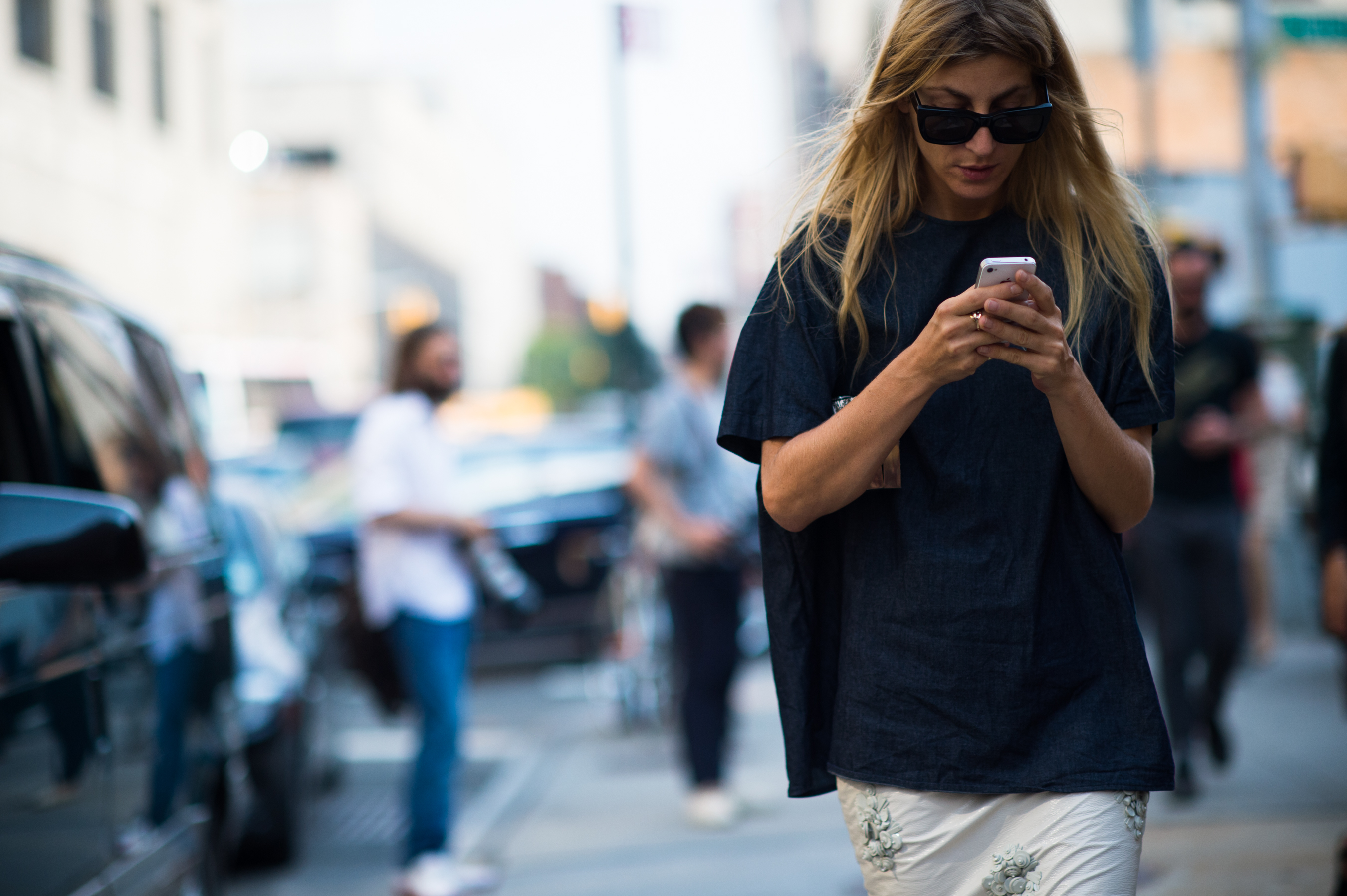 Stylist texting on her phone