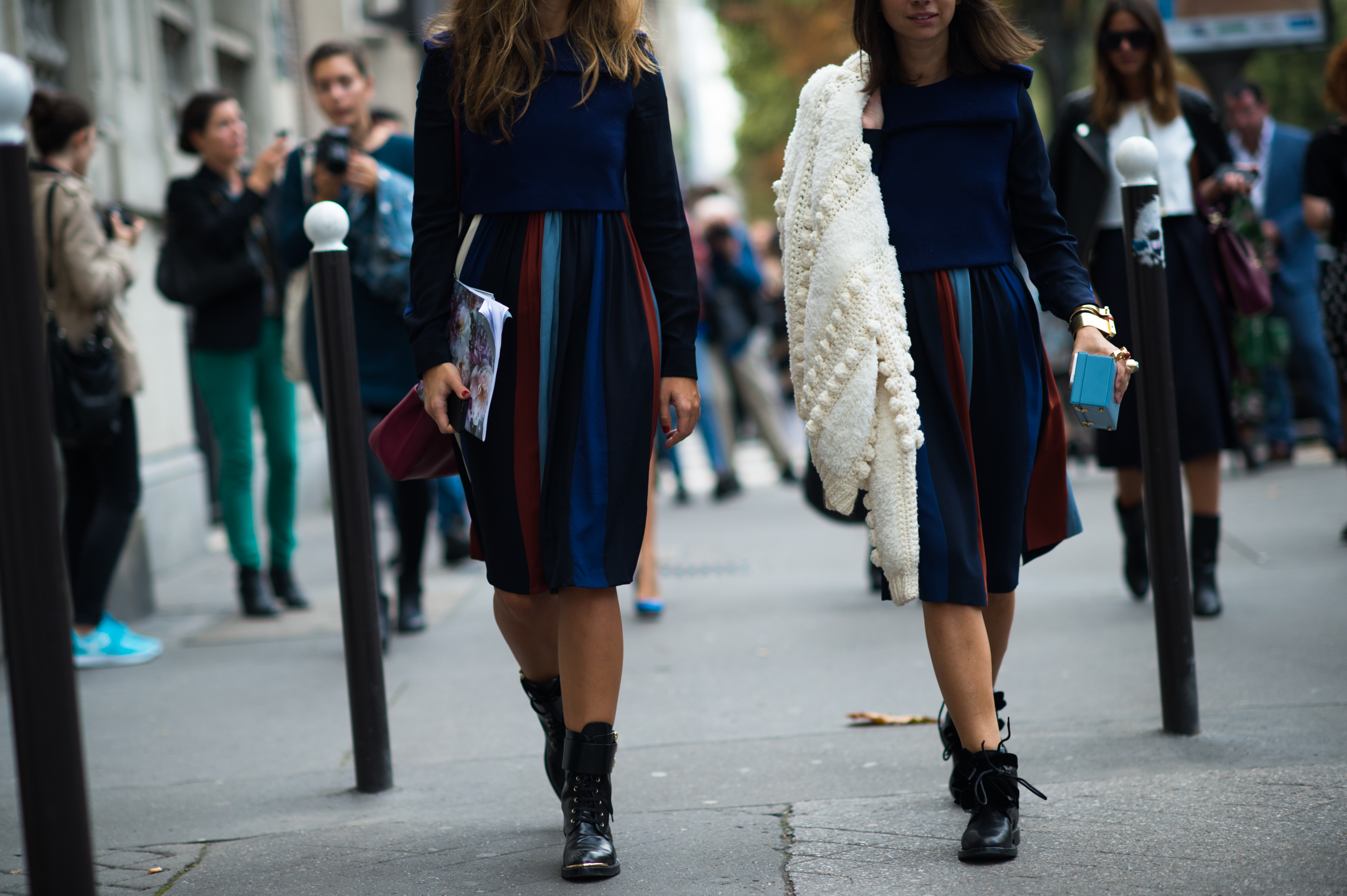 Two women wearing matching skirts