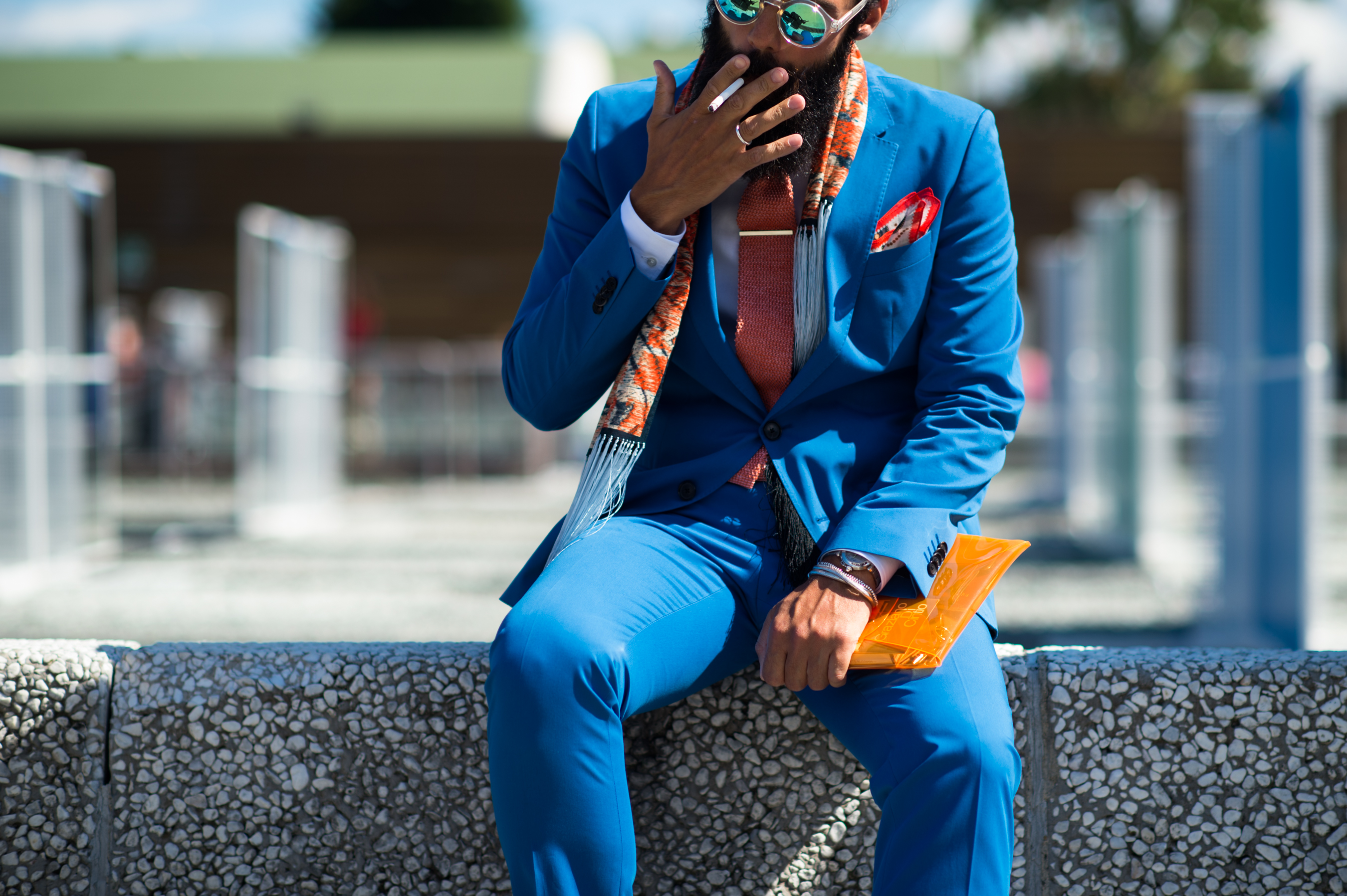 Man smoking in a blue suit