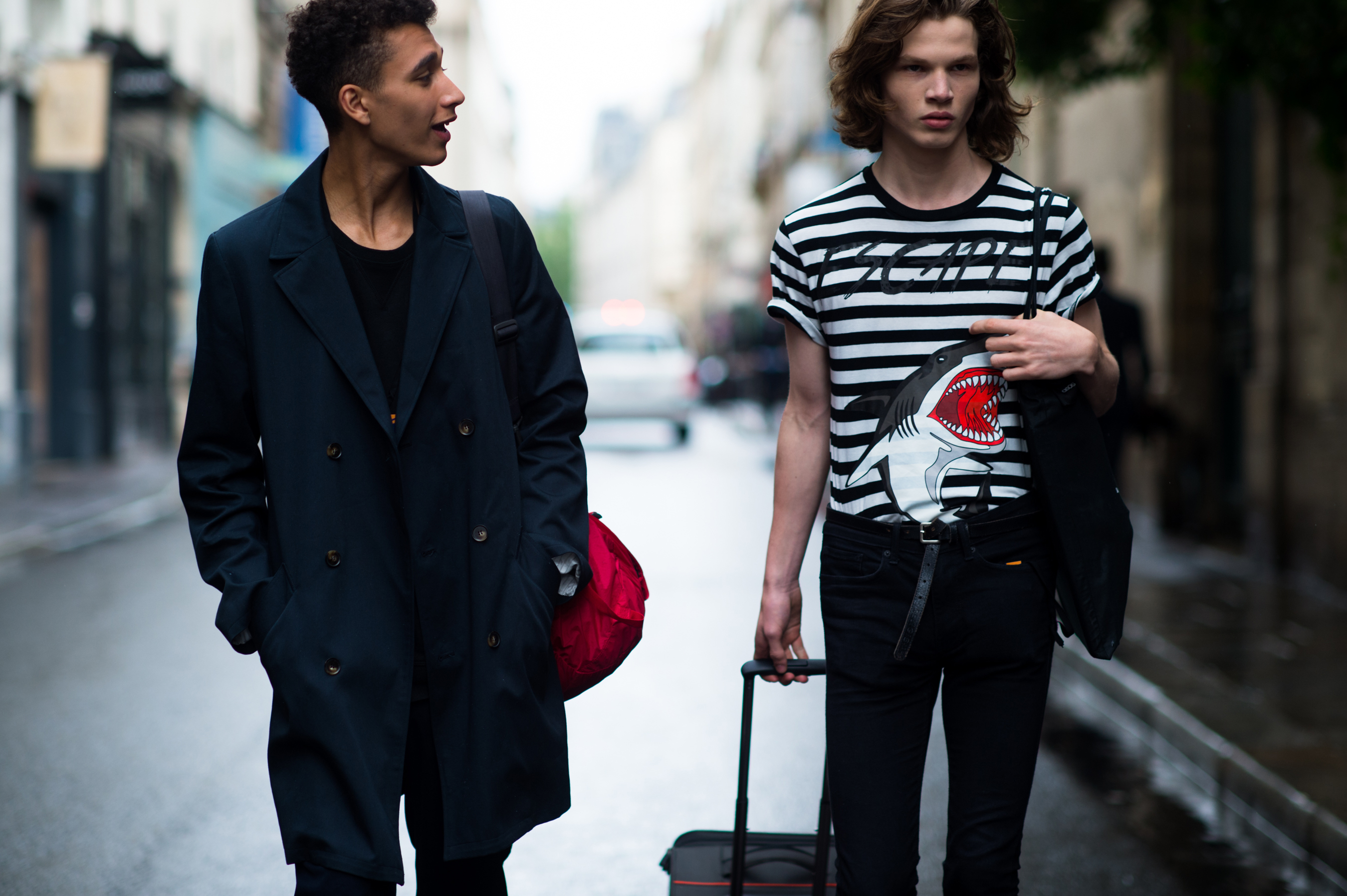 Two male models after a fashion show