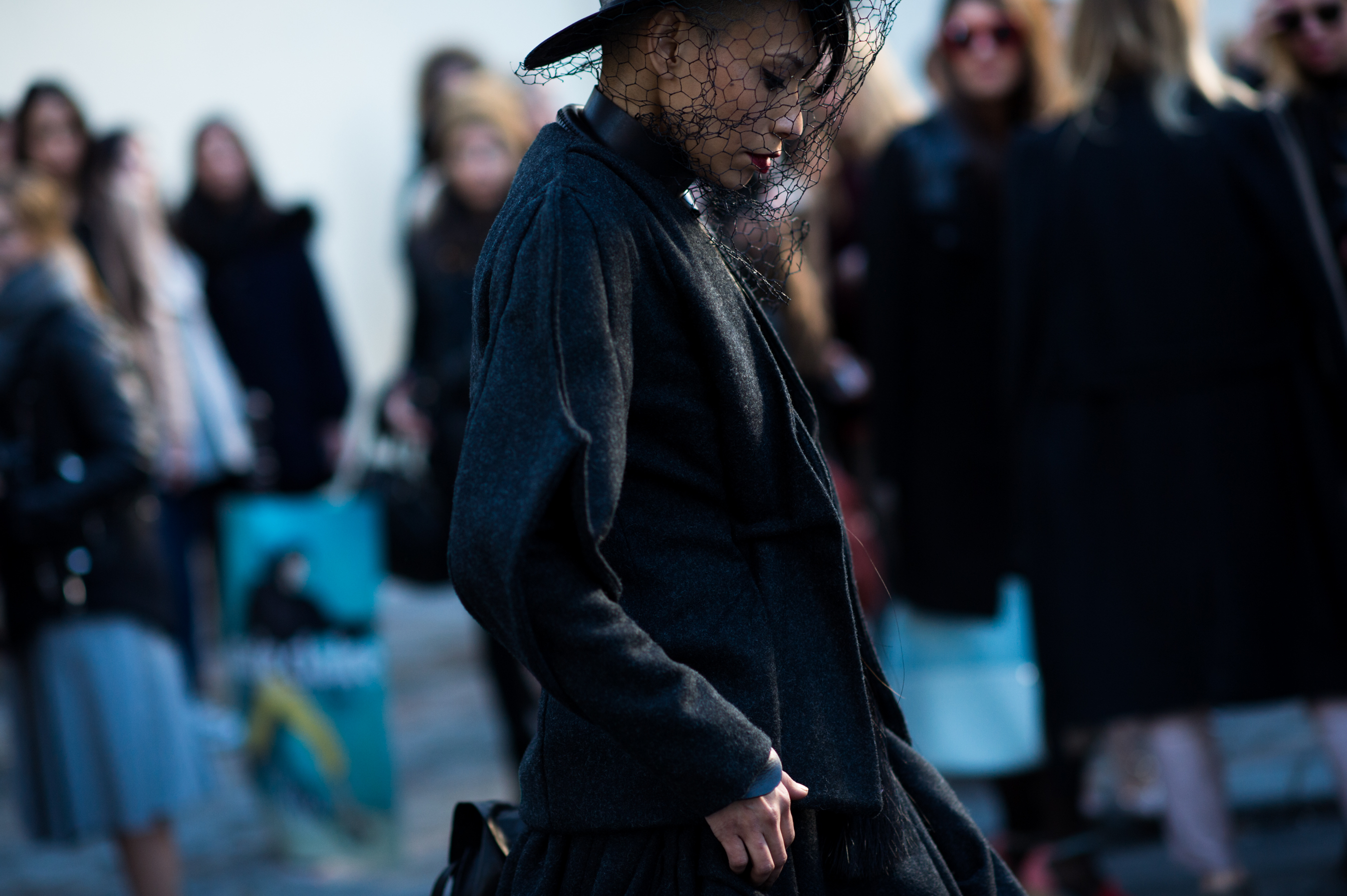 Woman wearing a black mesh veil