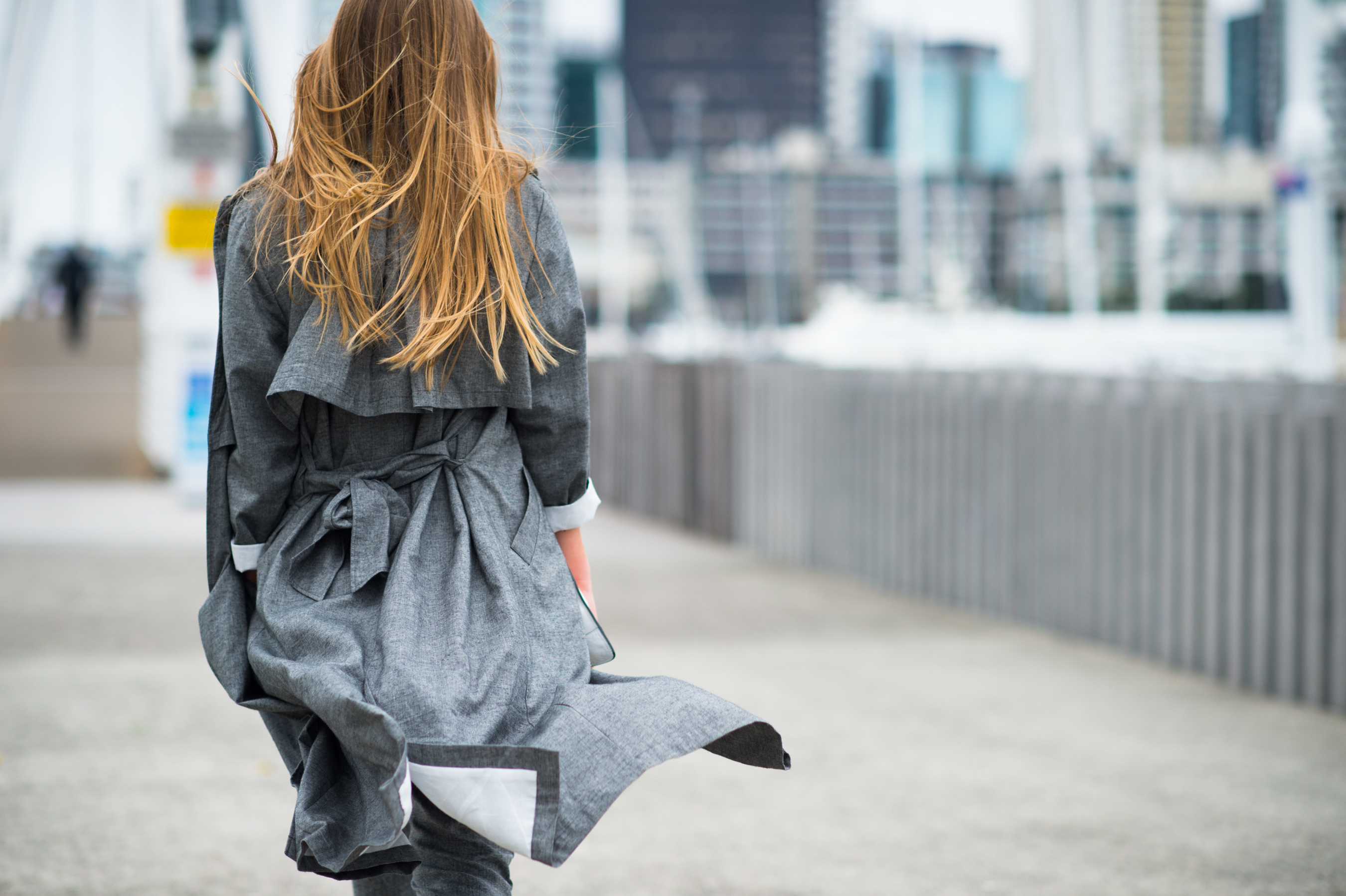Kiwi woman wearing a grey Huffer trench
