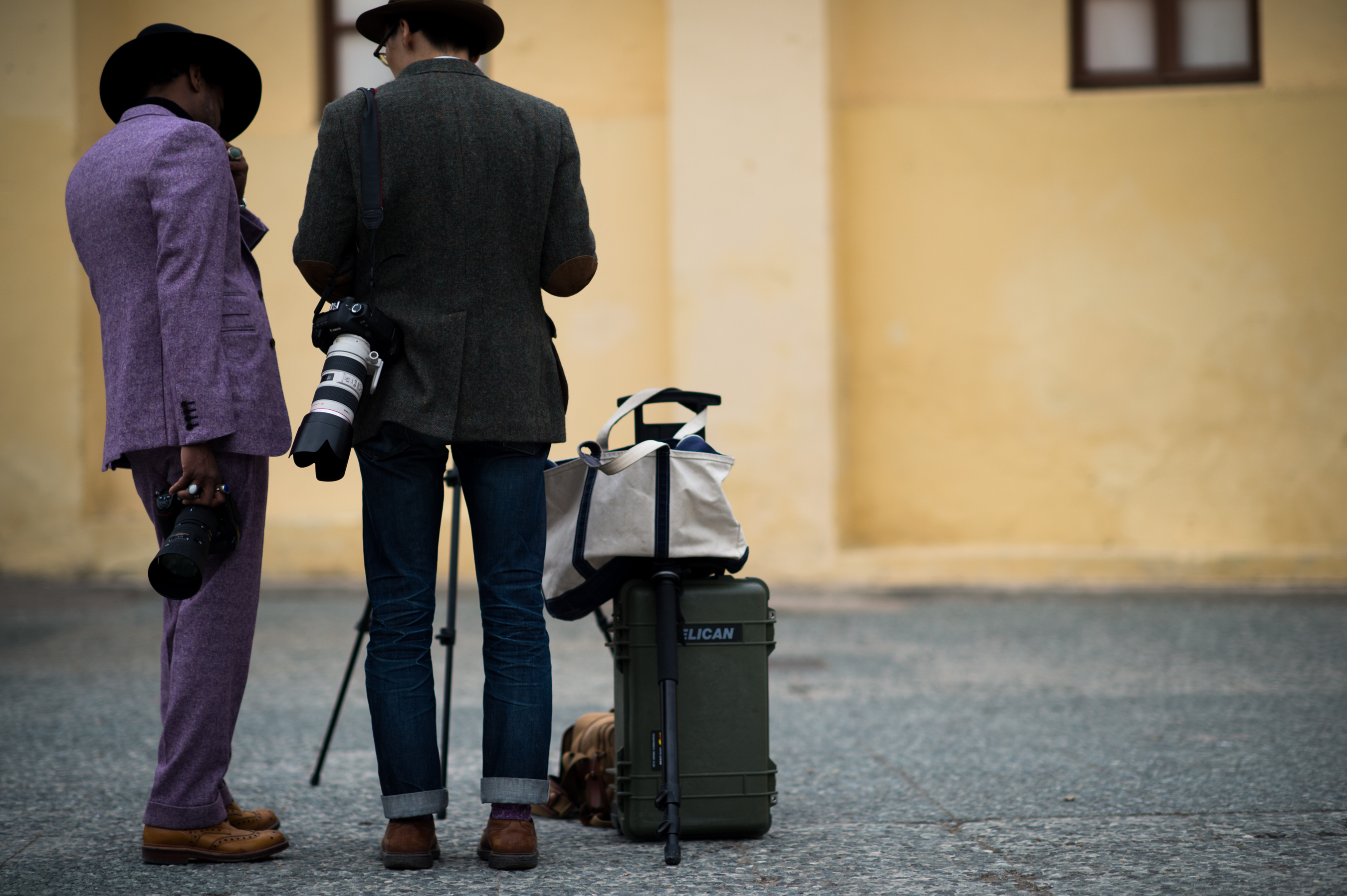 Two photographers wearing suits