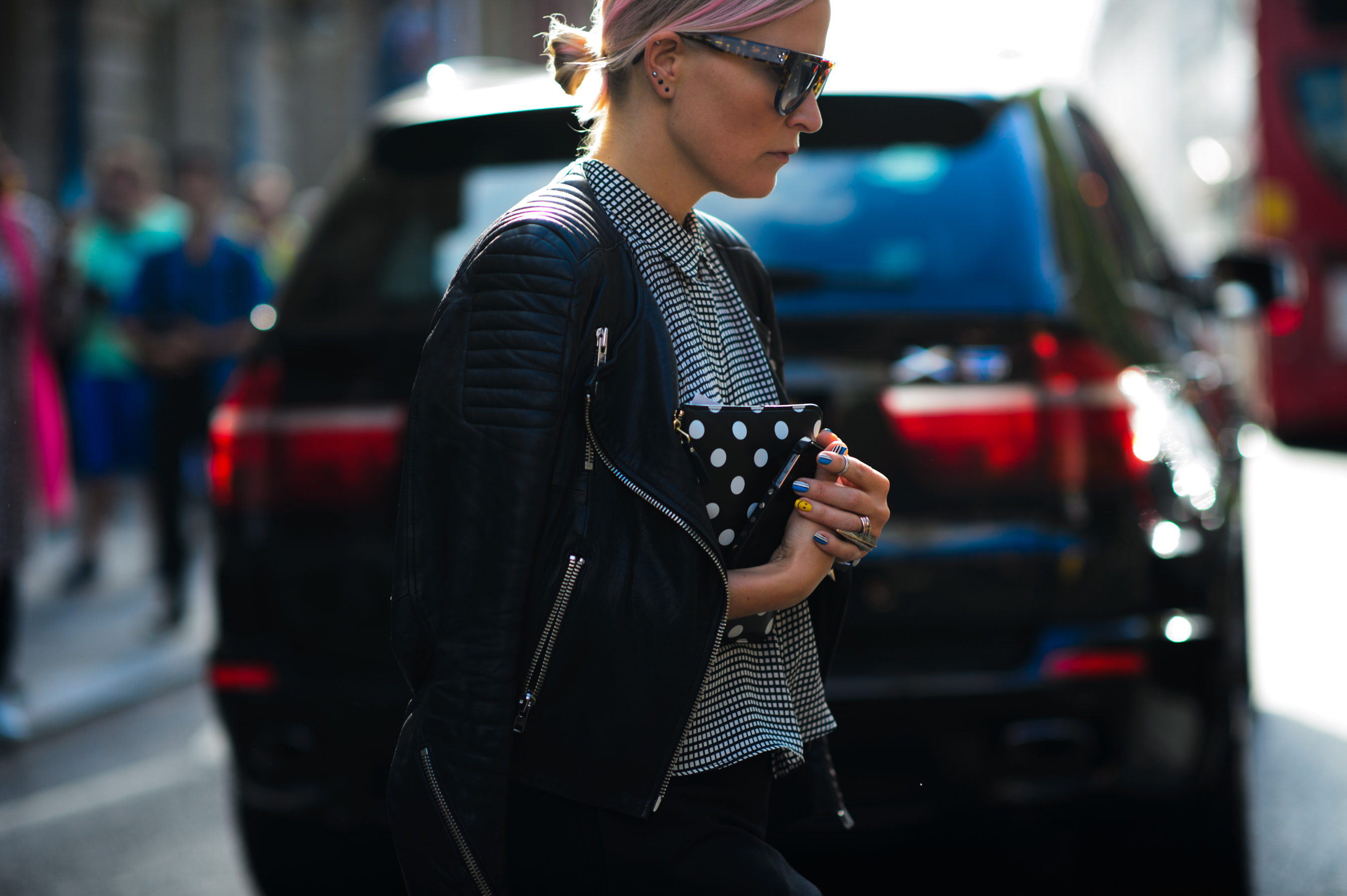 Woman with pink hair and a leather jacket