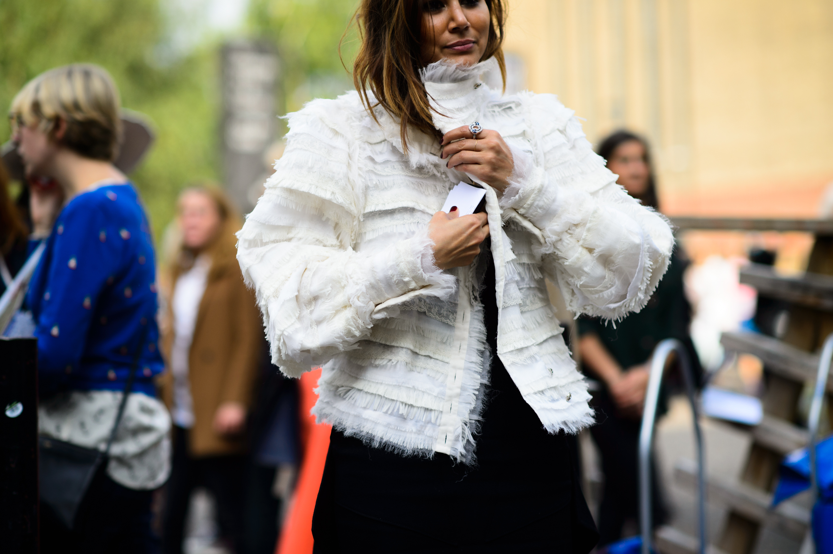 Australian editor wearing a white jacket