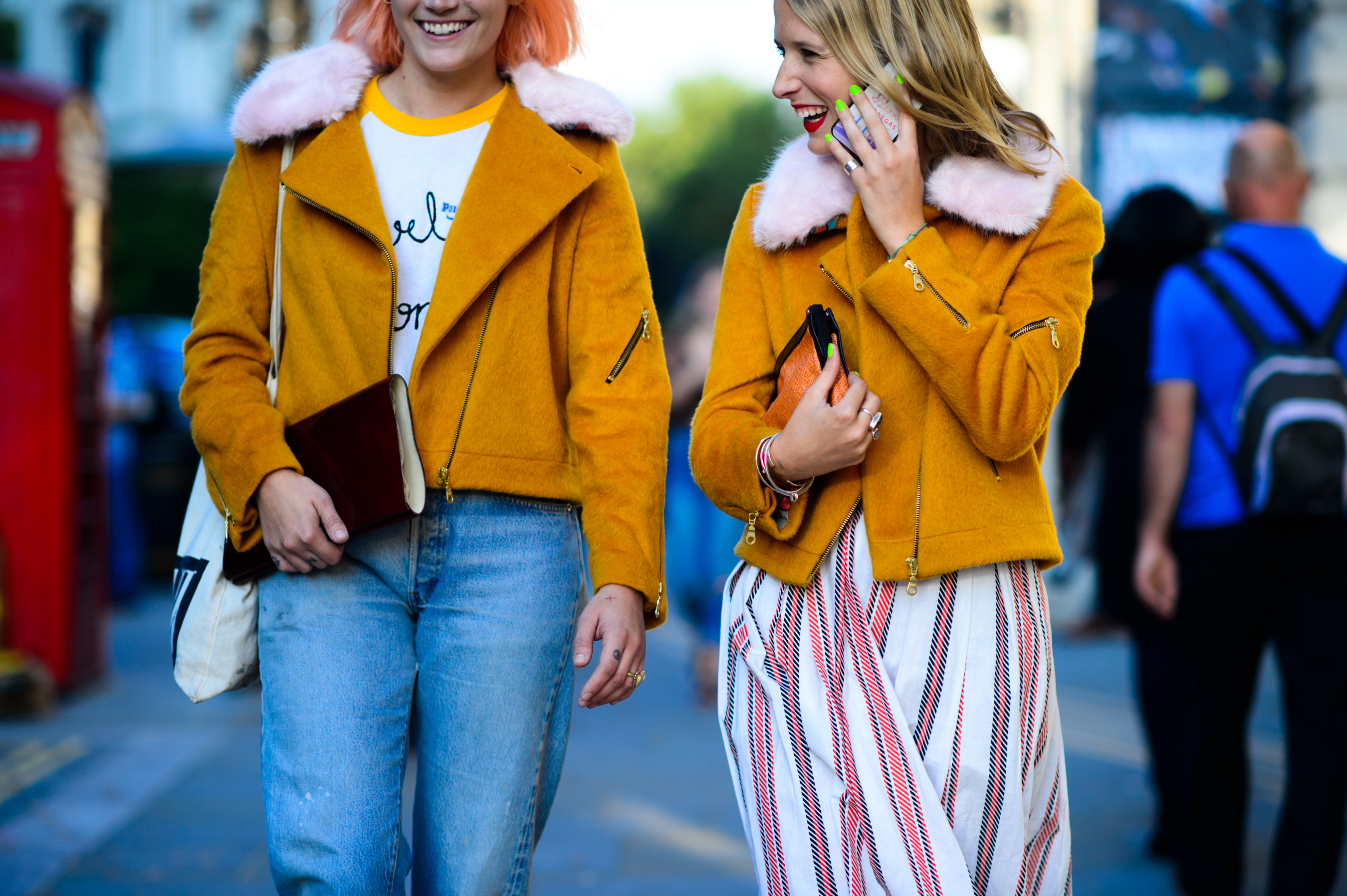 Two women wearing orange Perfecto jackets