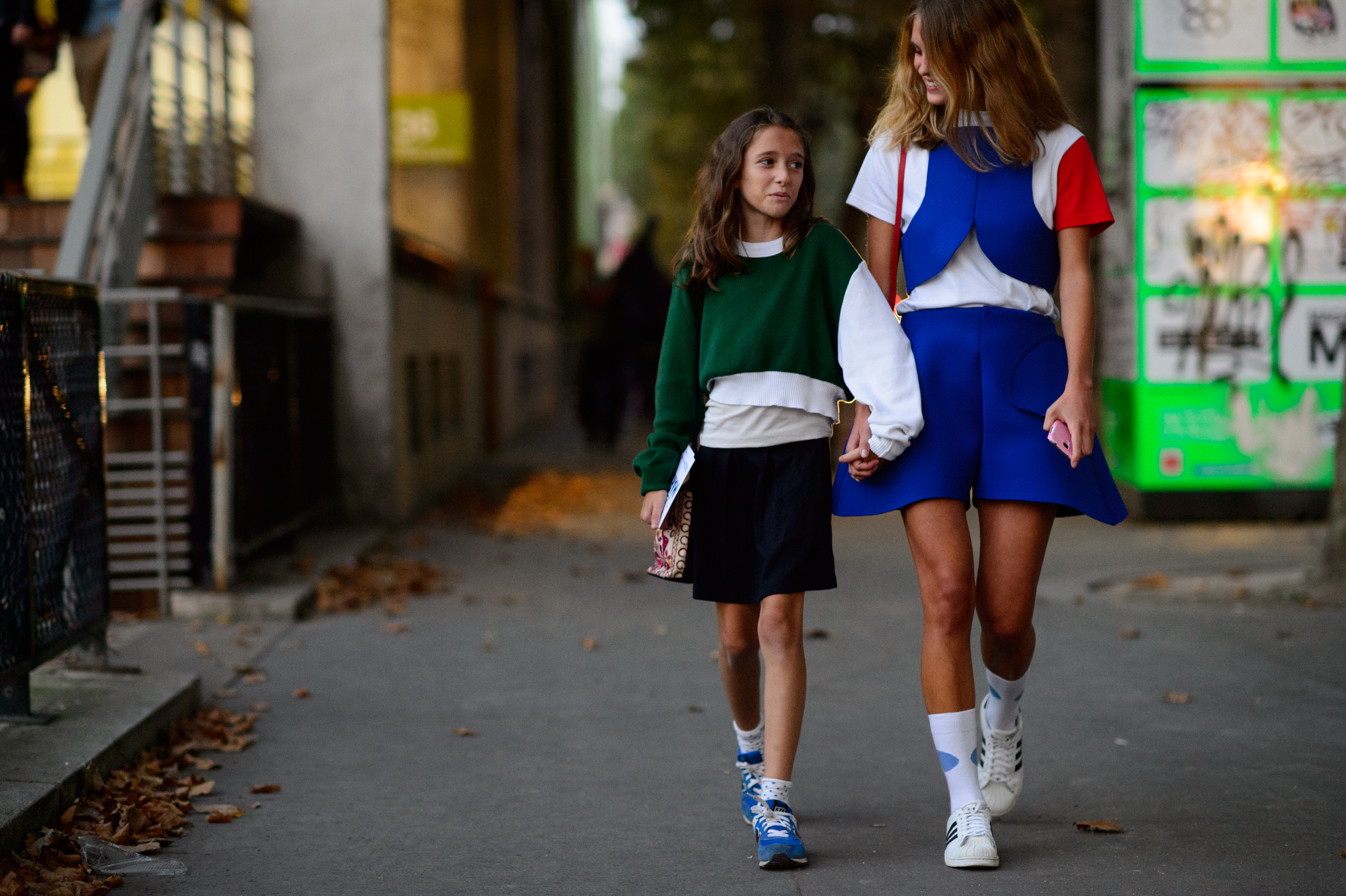 Two girls wearing the same designer