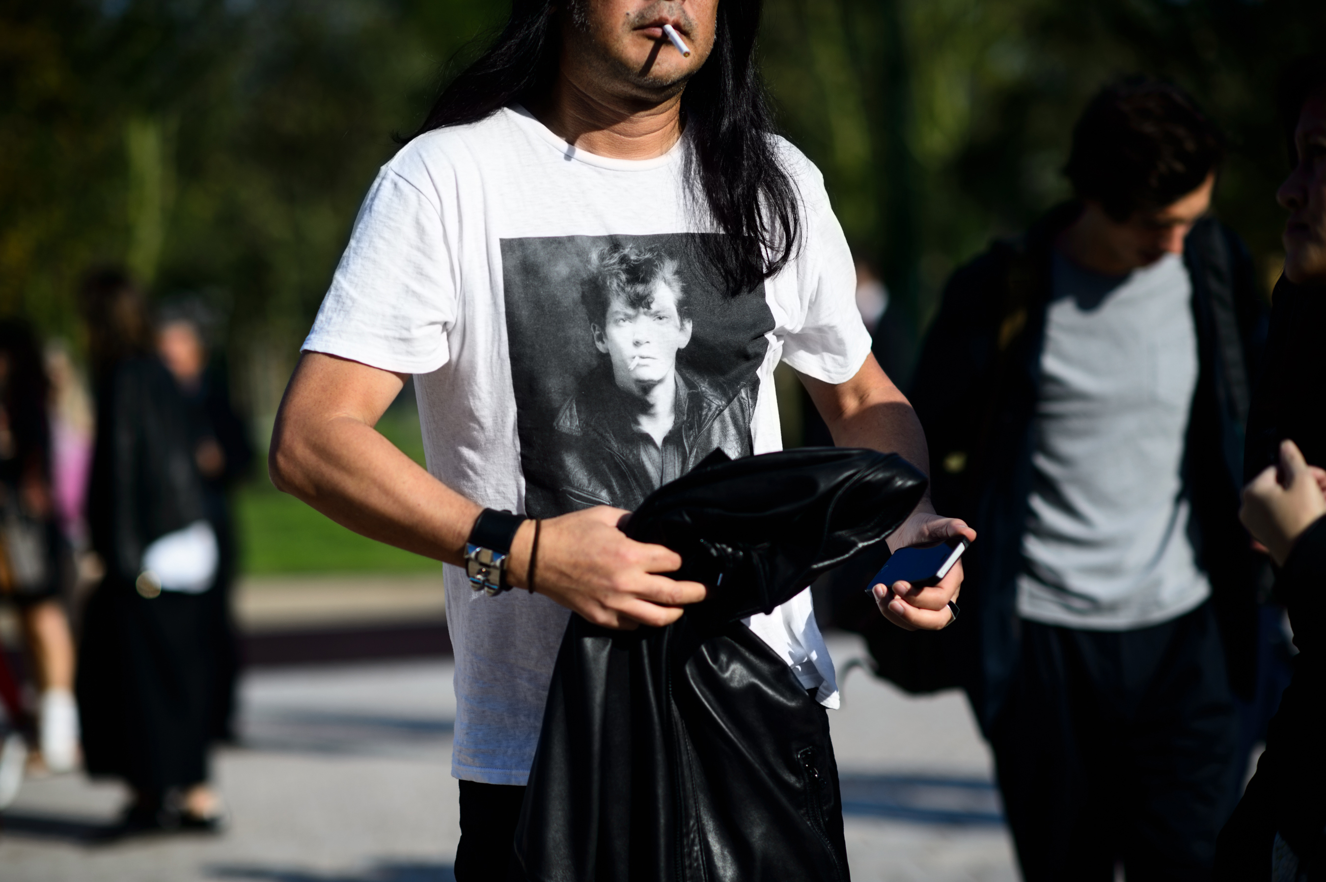 Man smoking in a Robert Mapplethorpe t shirt