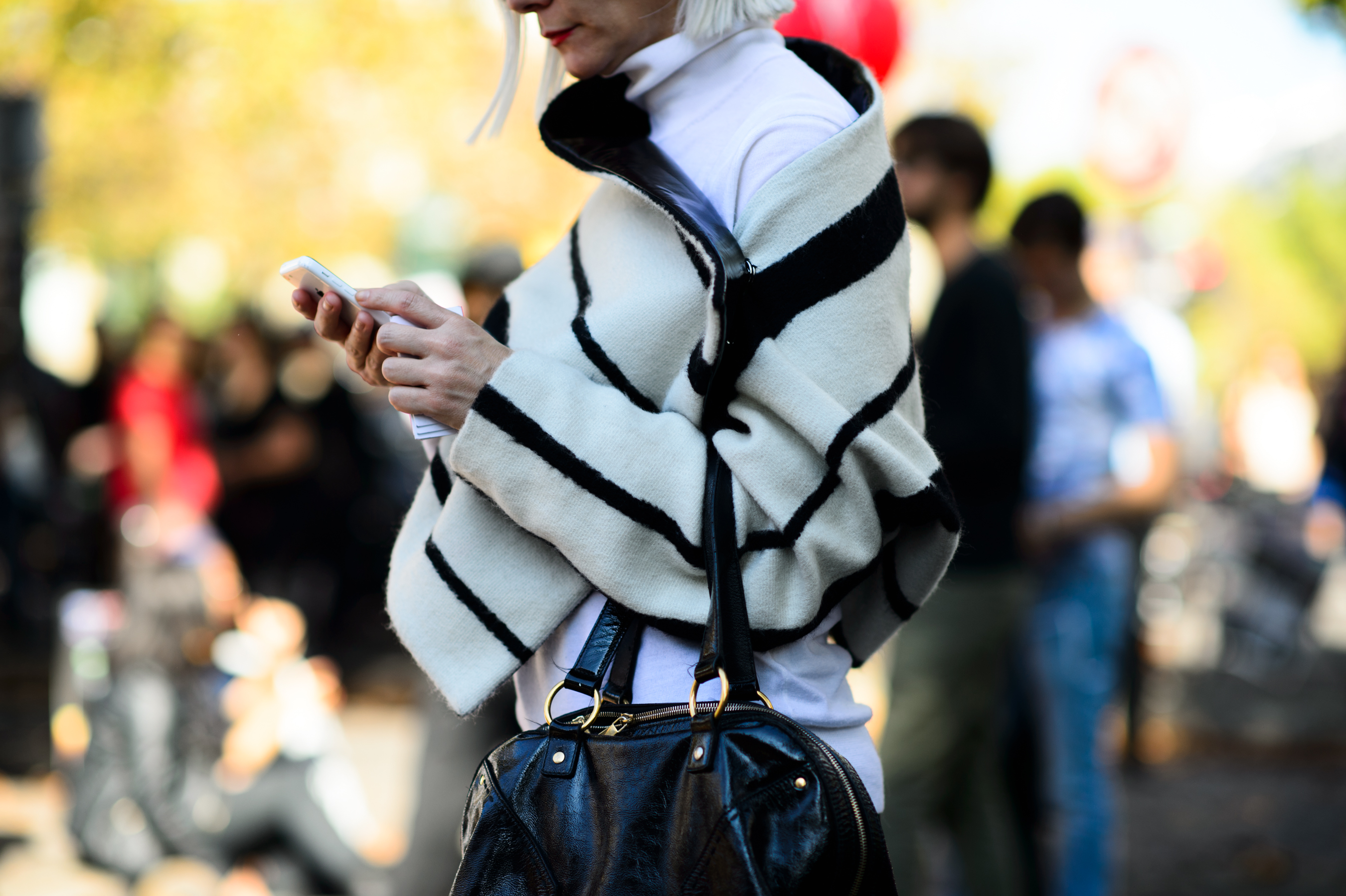 Woman with grey hair at a fashion show