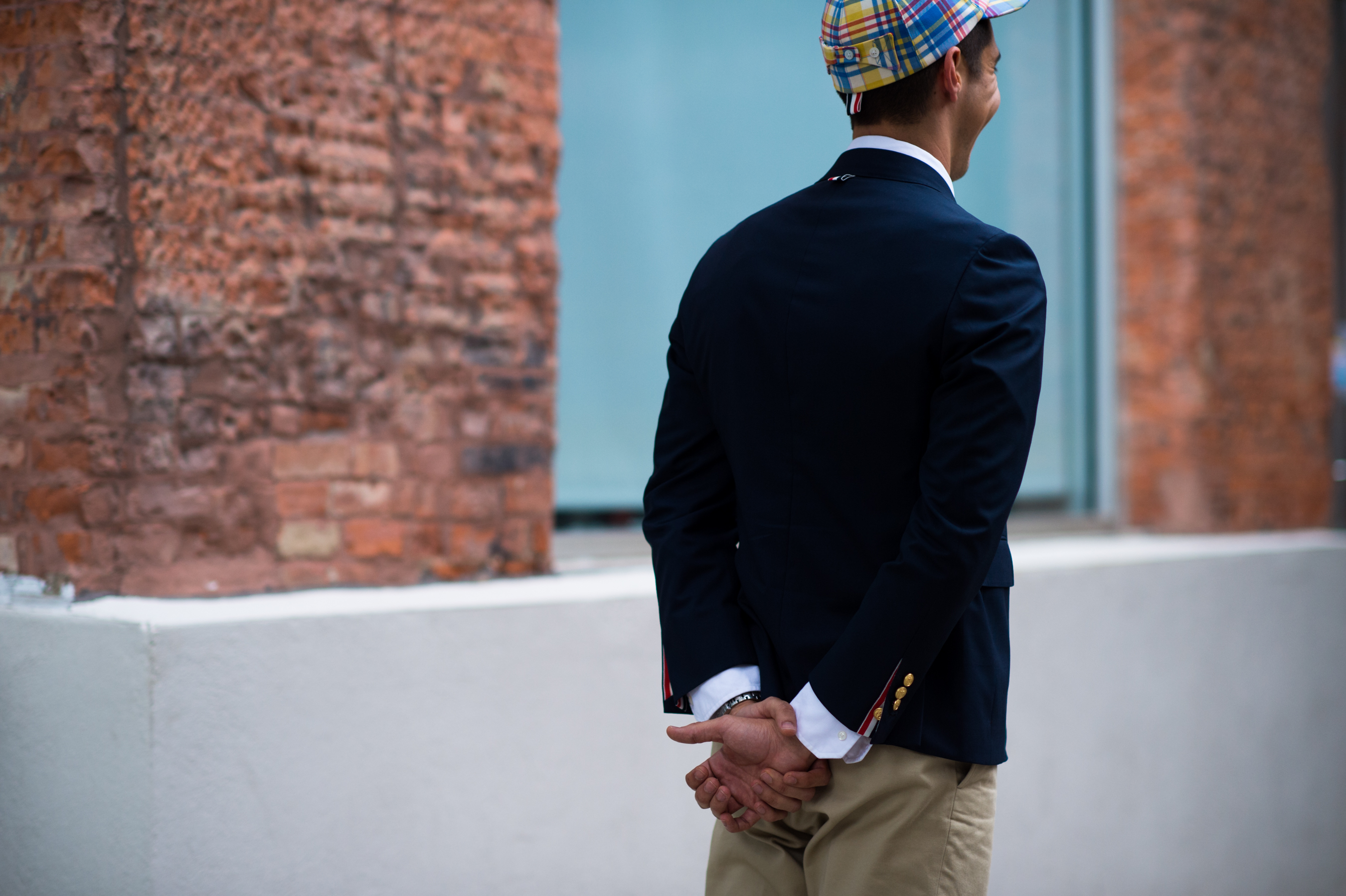 Man wearing a plaid baseball cap