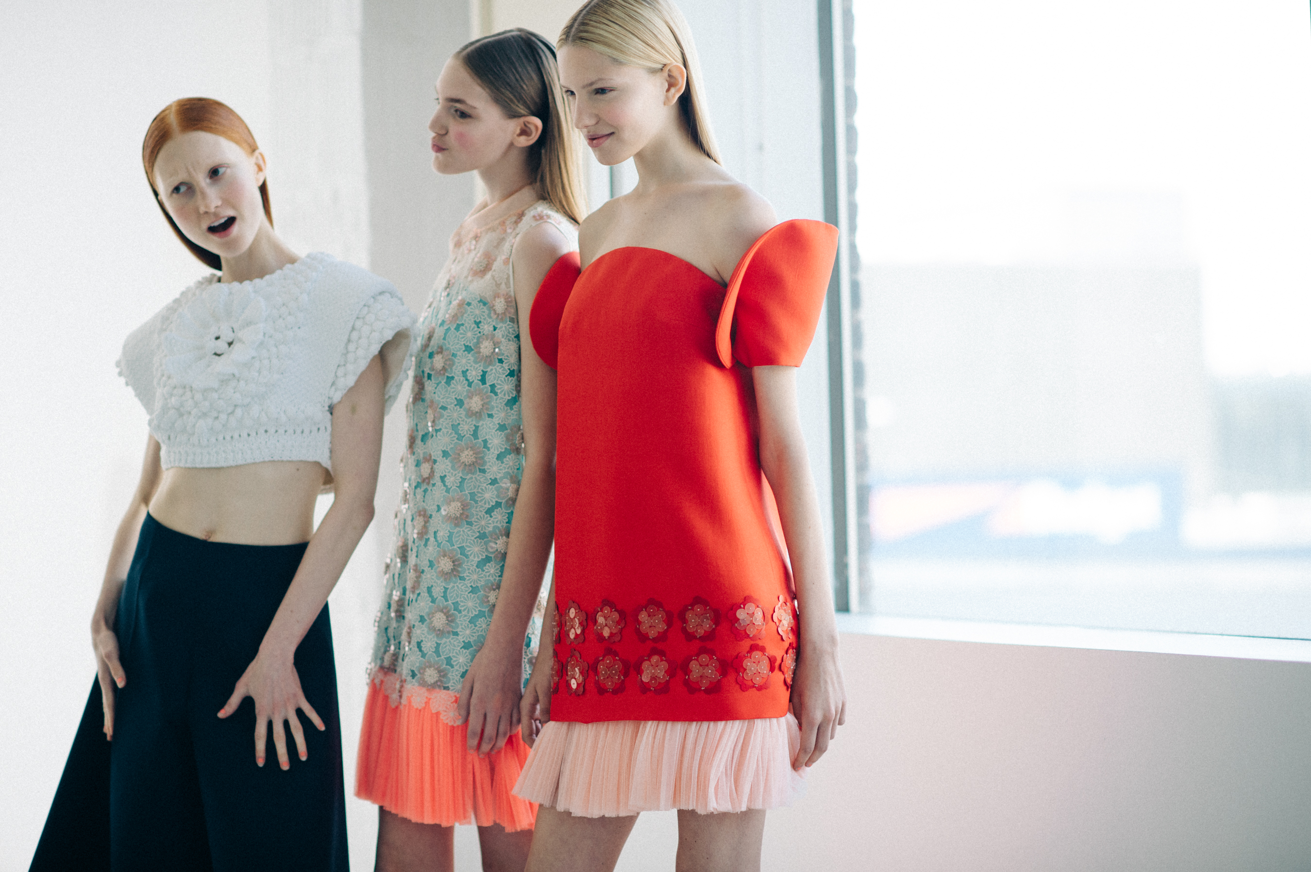 Three models before a fashion show