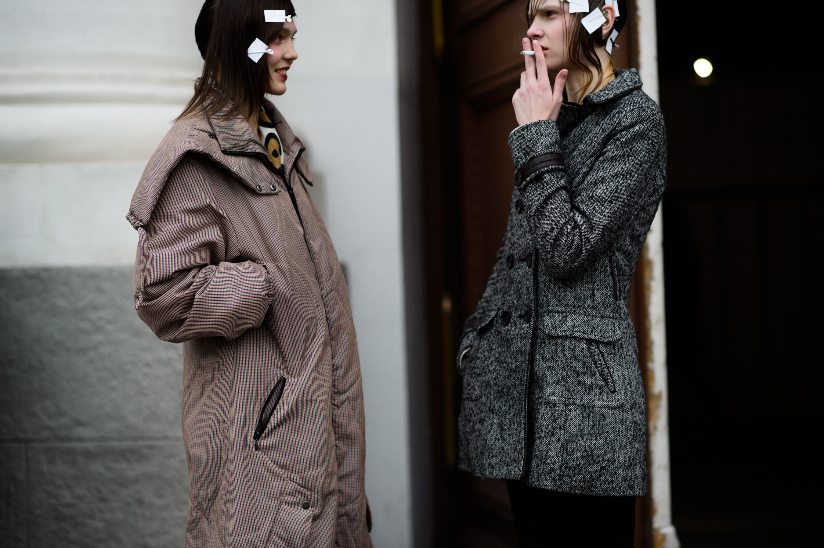 Two models smoking with hair pins