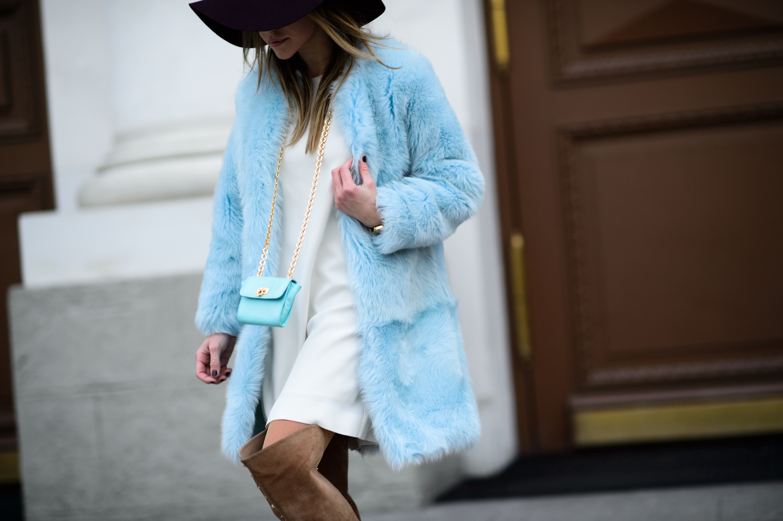 Russian girl wearing a blue shearling coat