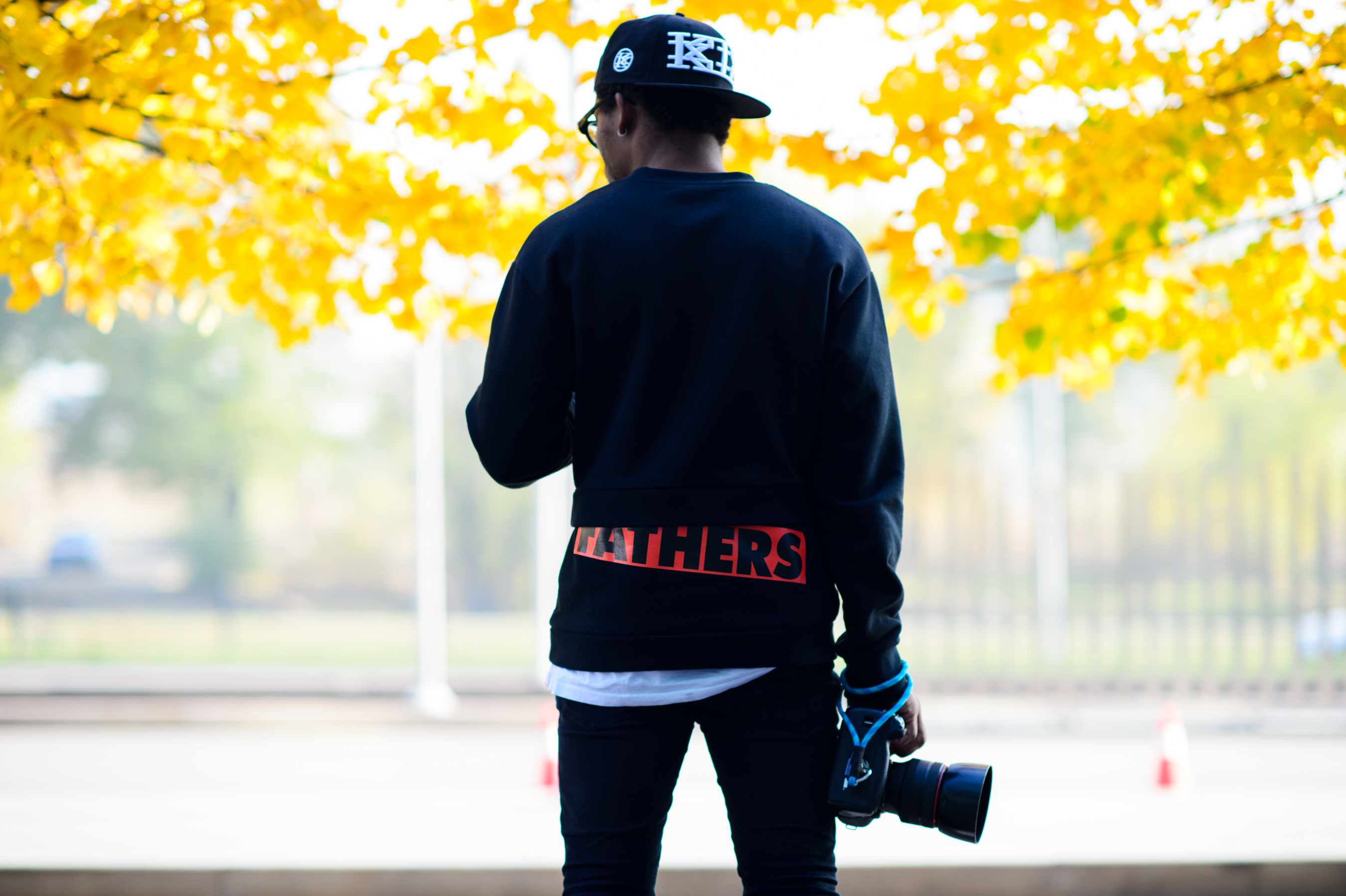 French photographer wearing Rat Simons and KTZ