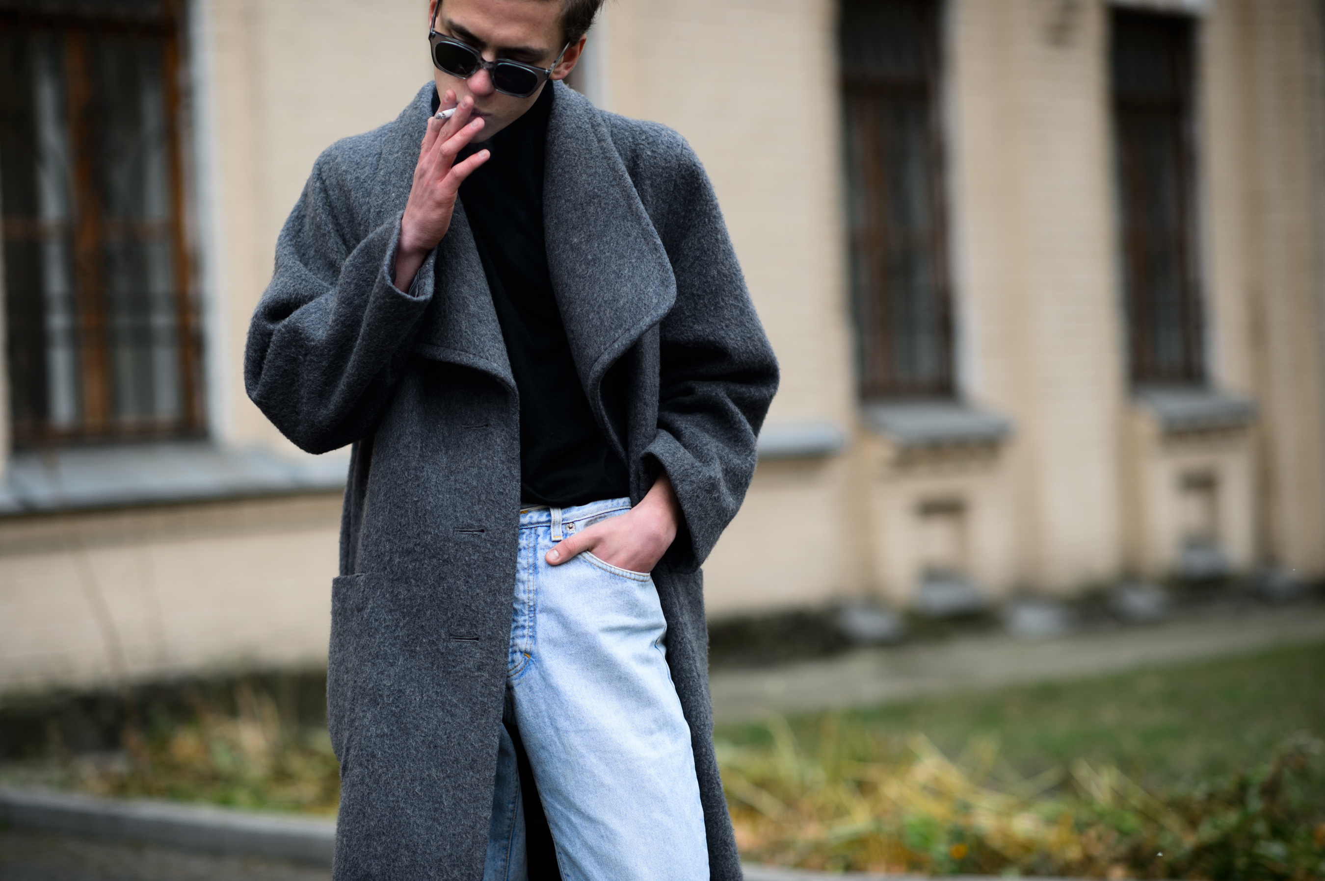 Man smoking in a Soviet coat
