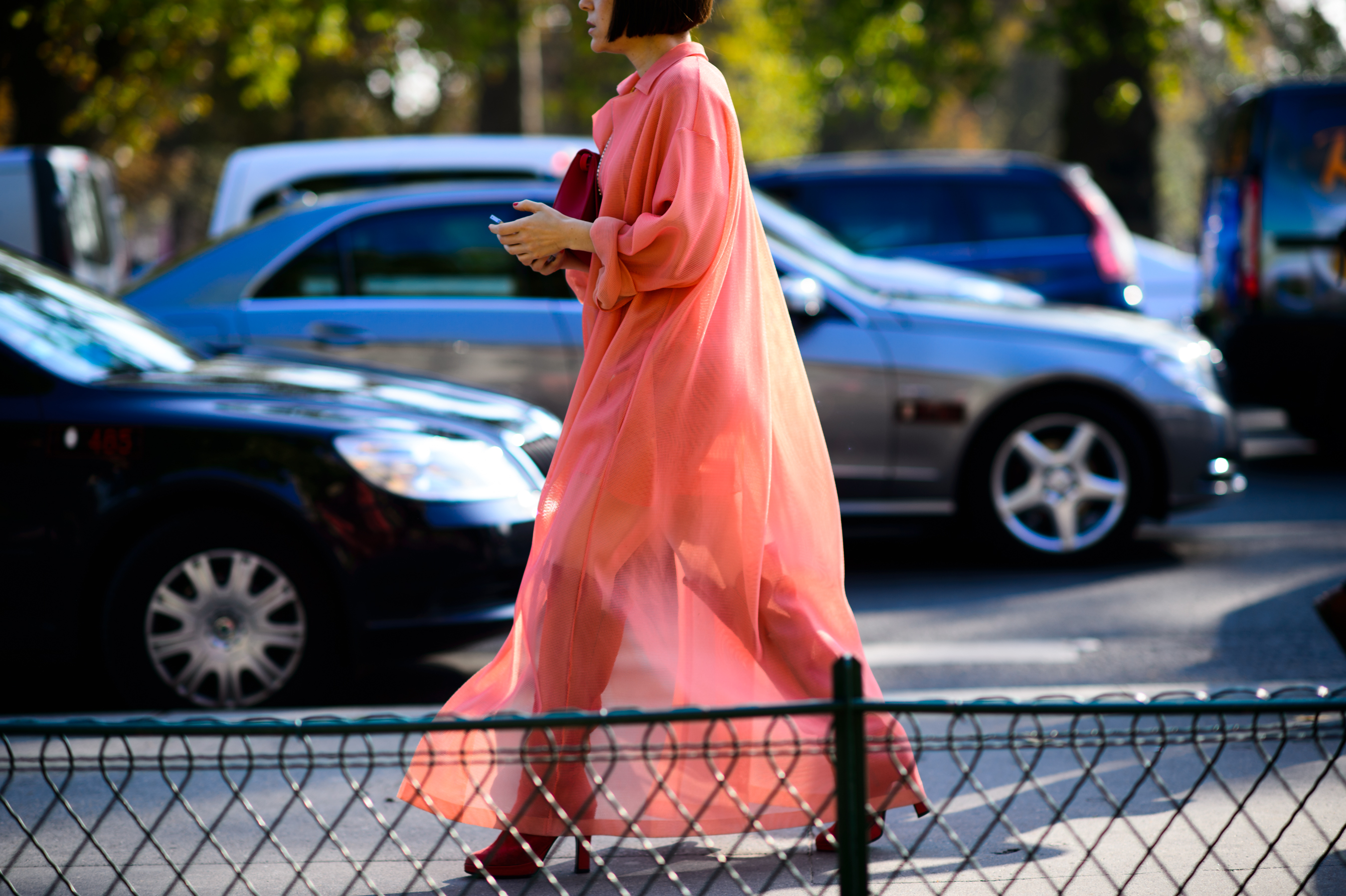 American editor wearing a sheer pink dress