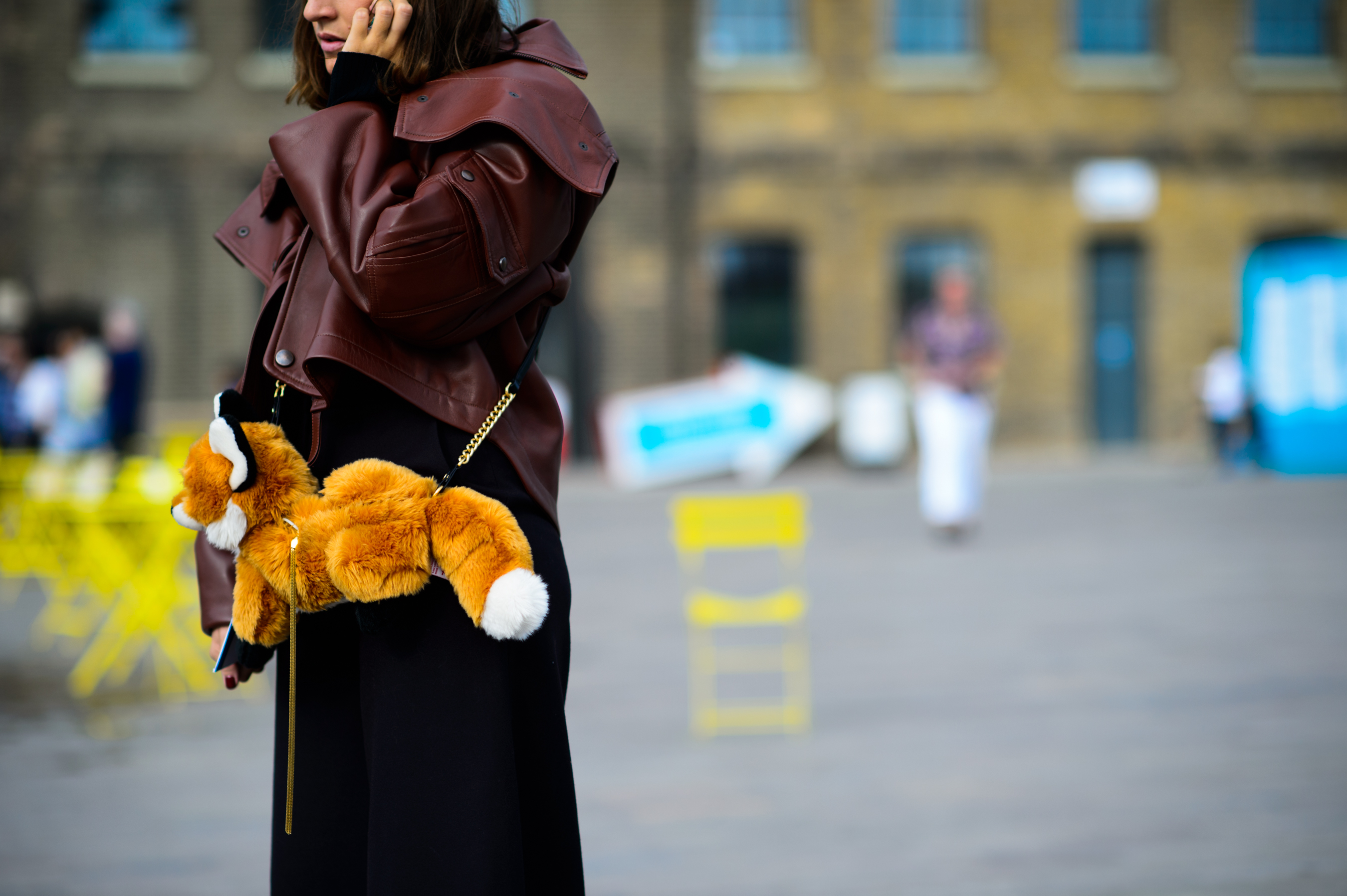 Woman with a stuffed fox bag