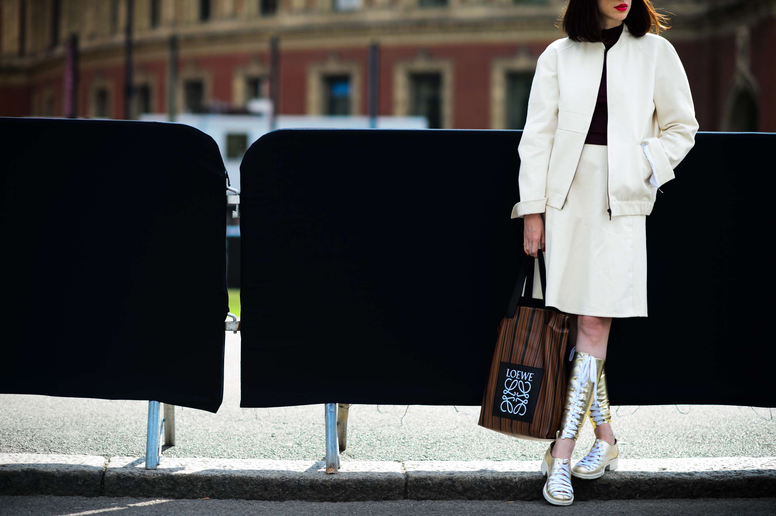 Girl wearing all white with red lips