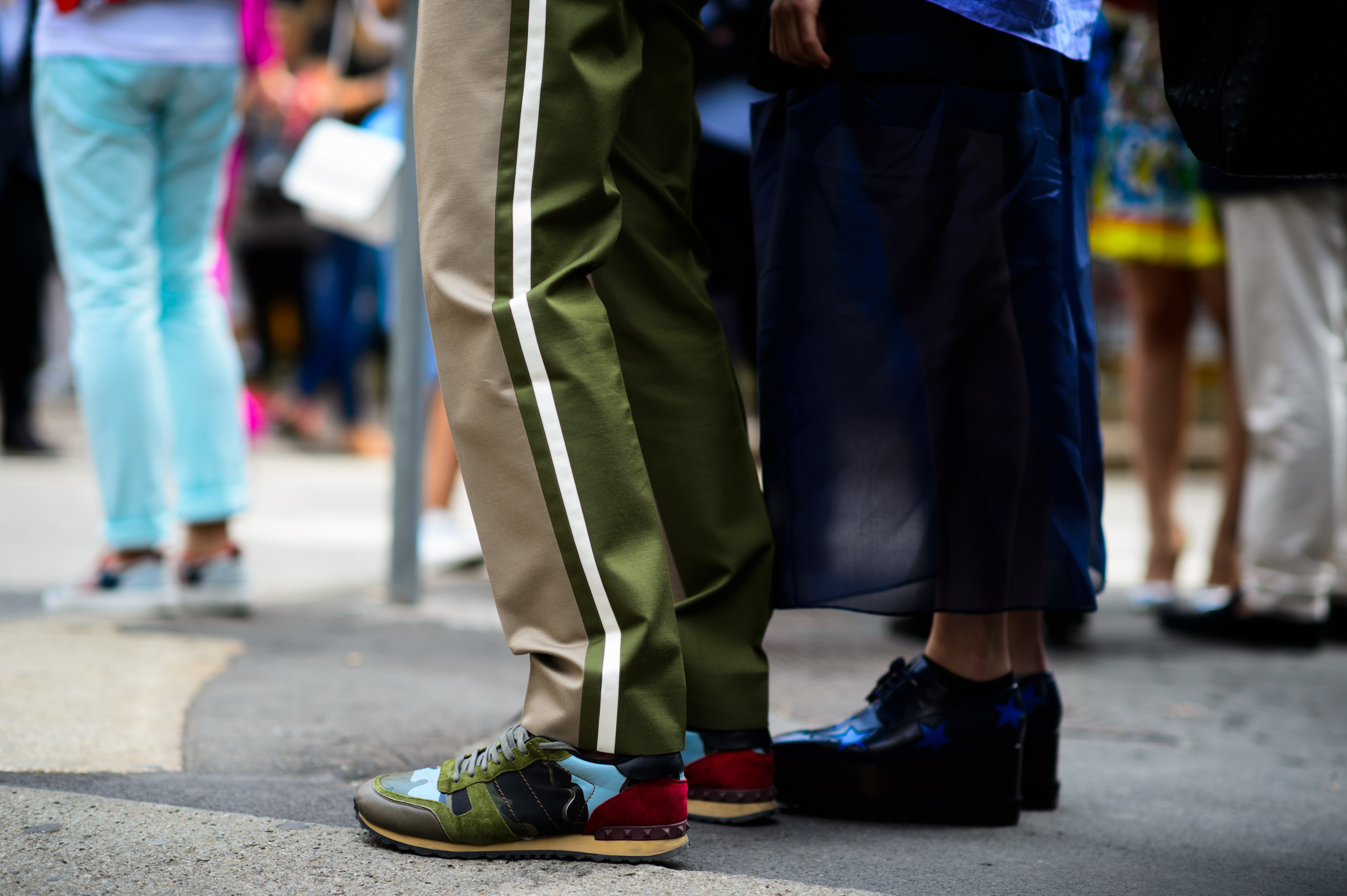 man and woman wearing blue and green