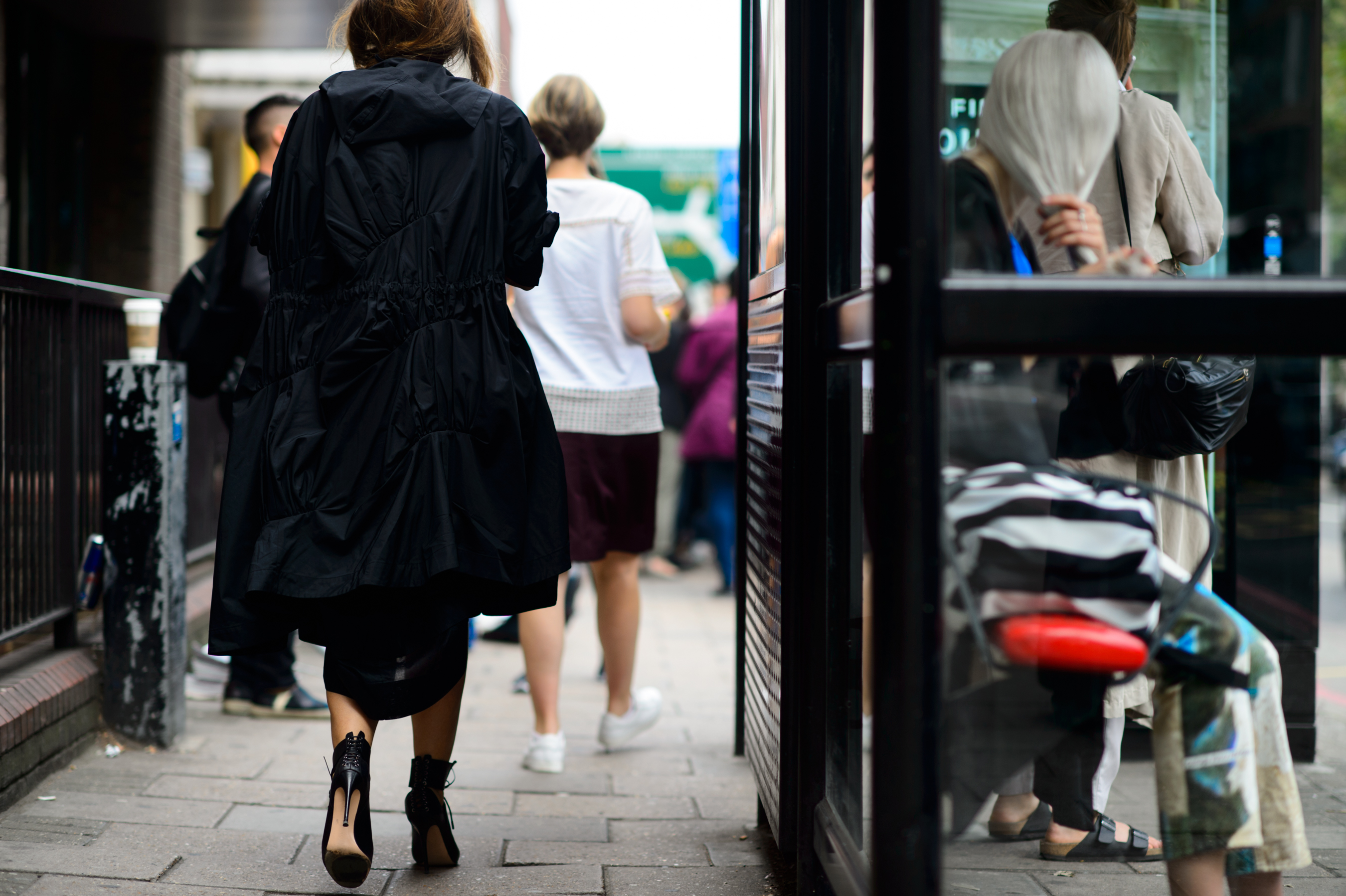 Woman wearing a cool black coat