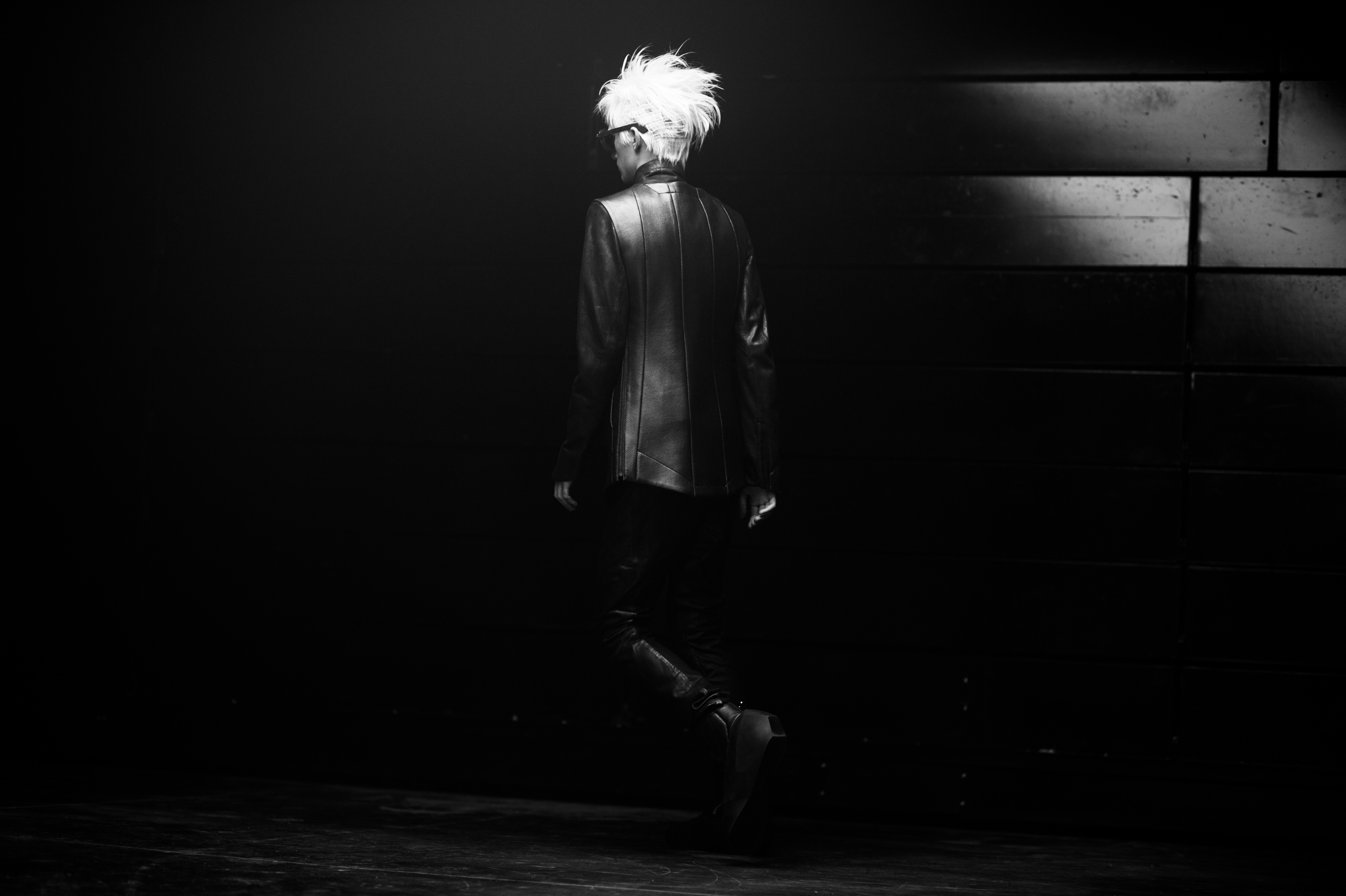 Male model walking a Japanese runway