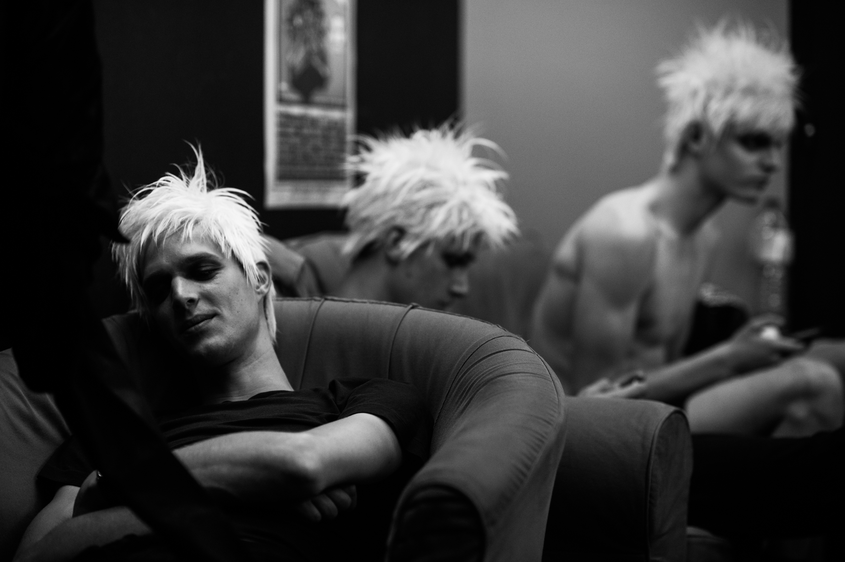 Male models wearing white wigs