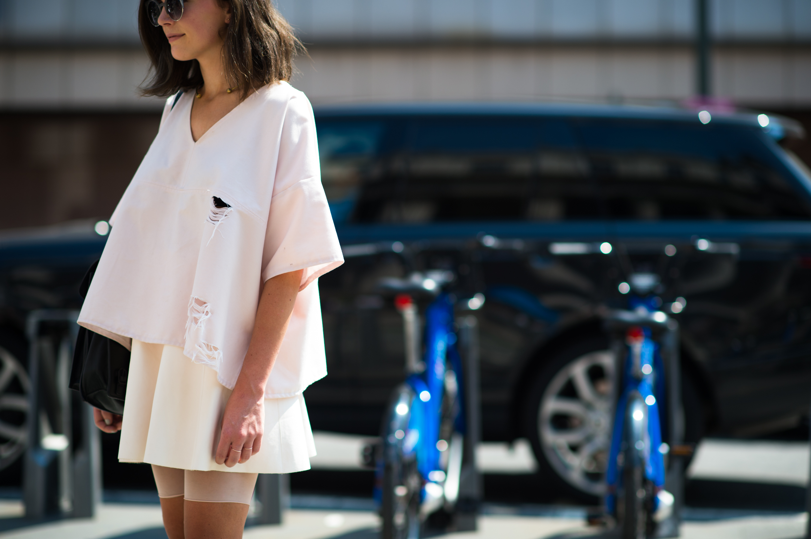 Woman wearing a distressed all white outfit