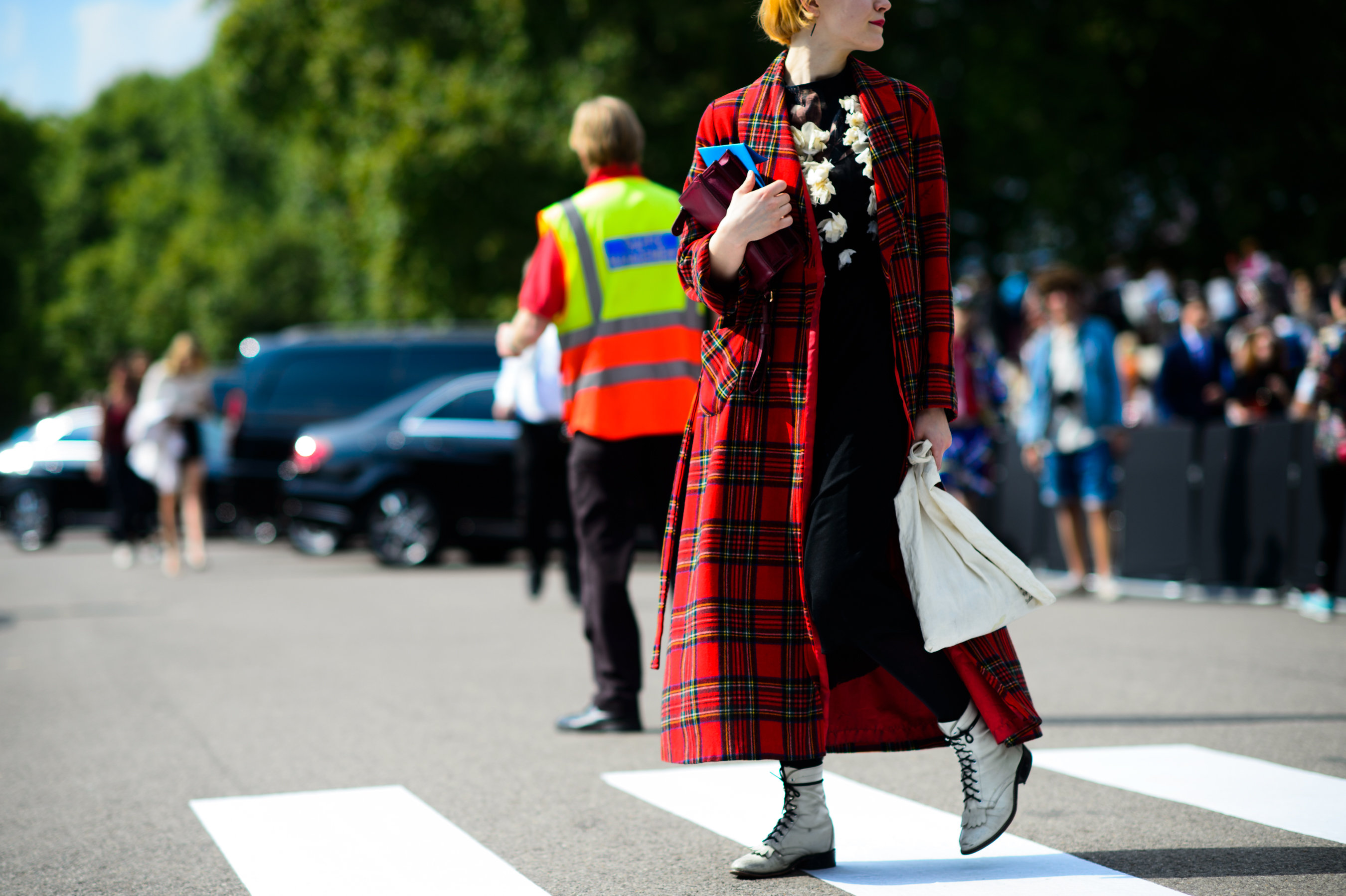 Woman wearing a tartan plaid coat