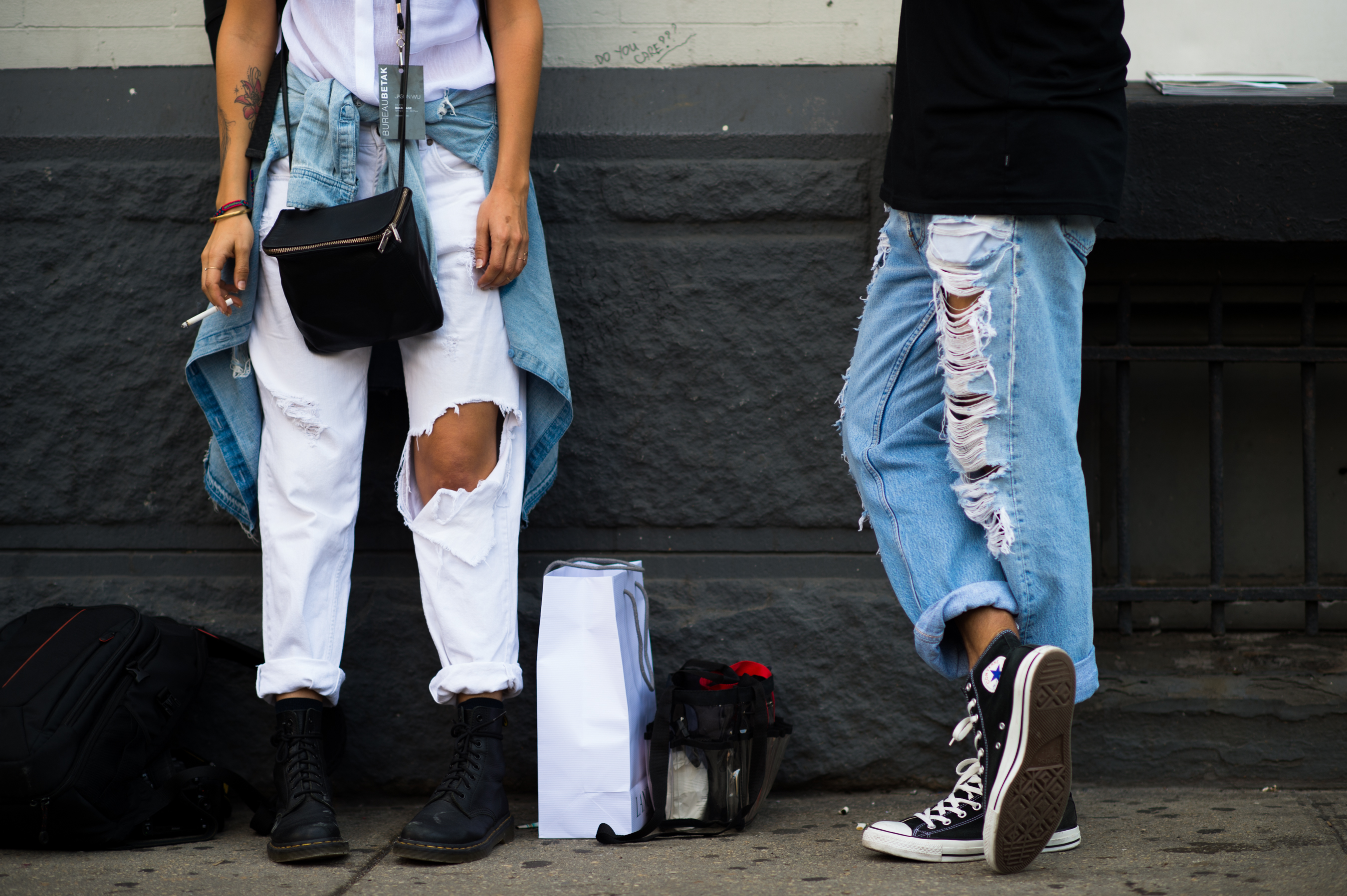 Man and woman wearing distressed denim