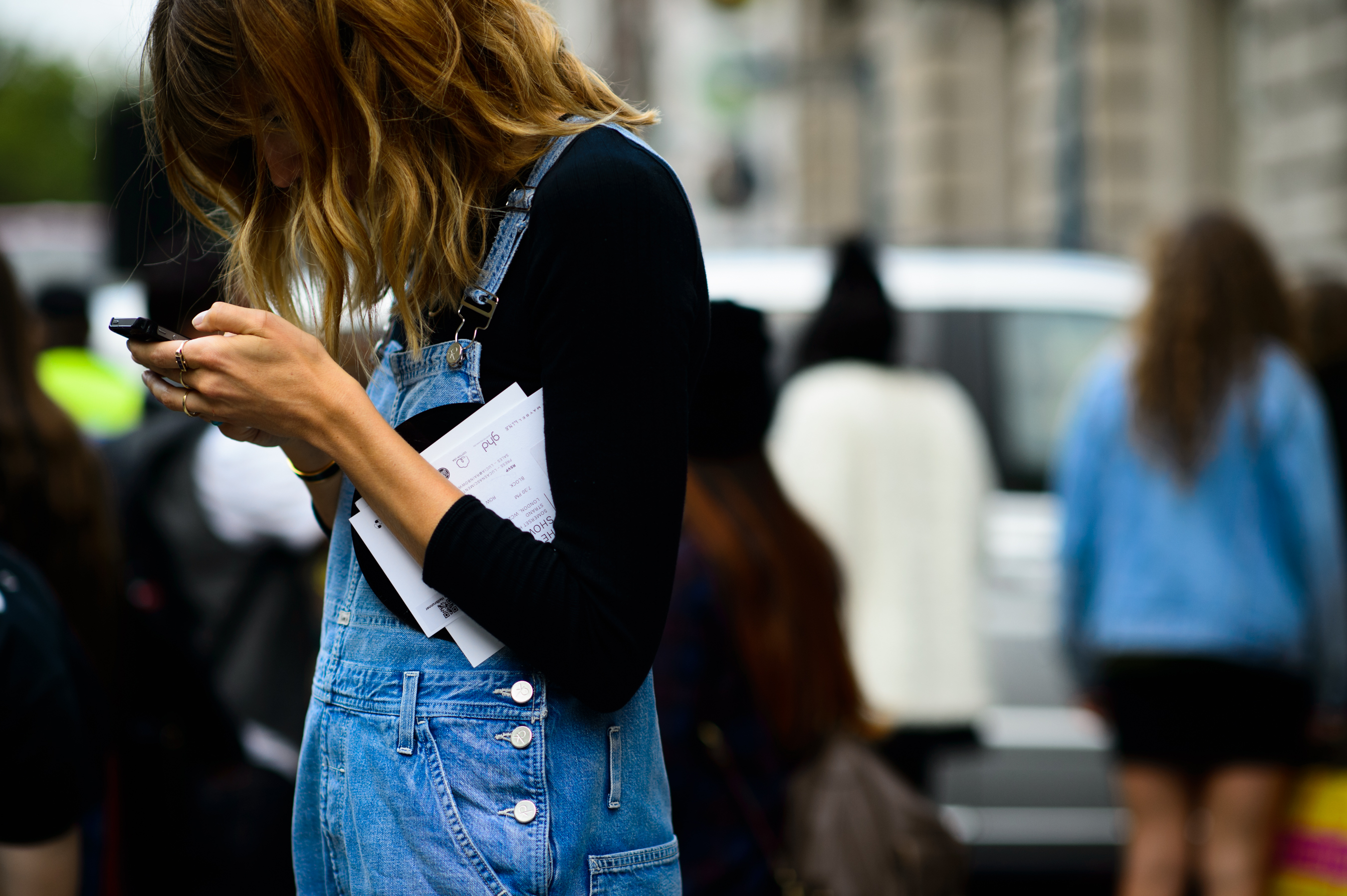 German woman wearing denim overalls