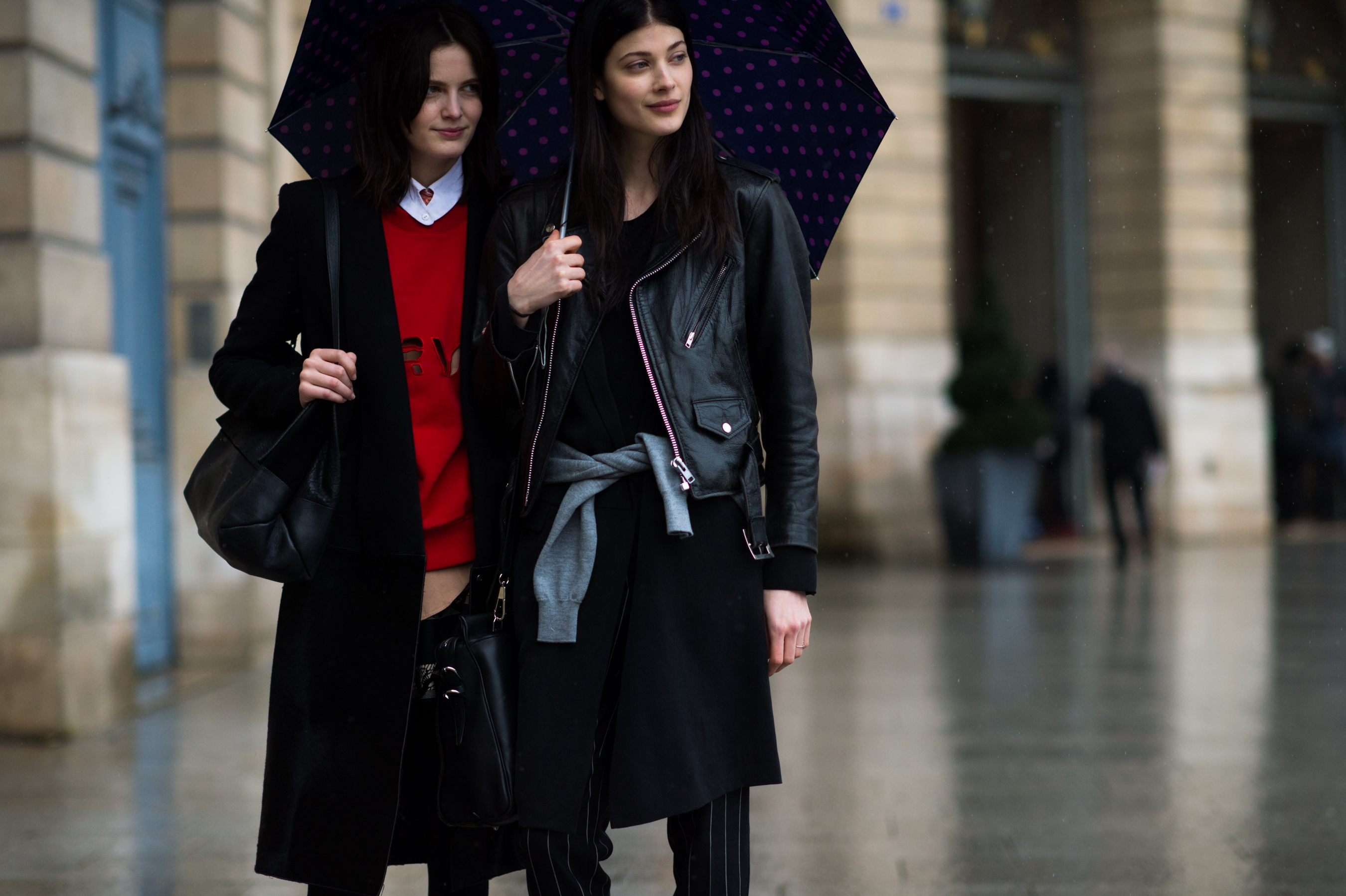 Two models standing in the rain