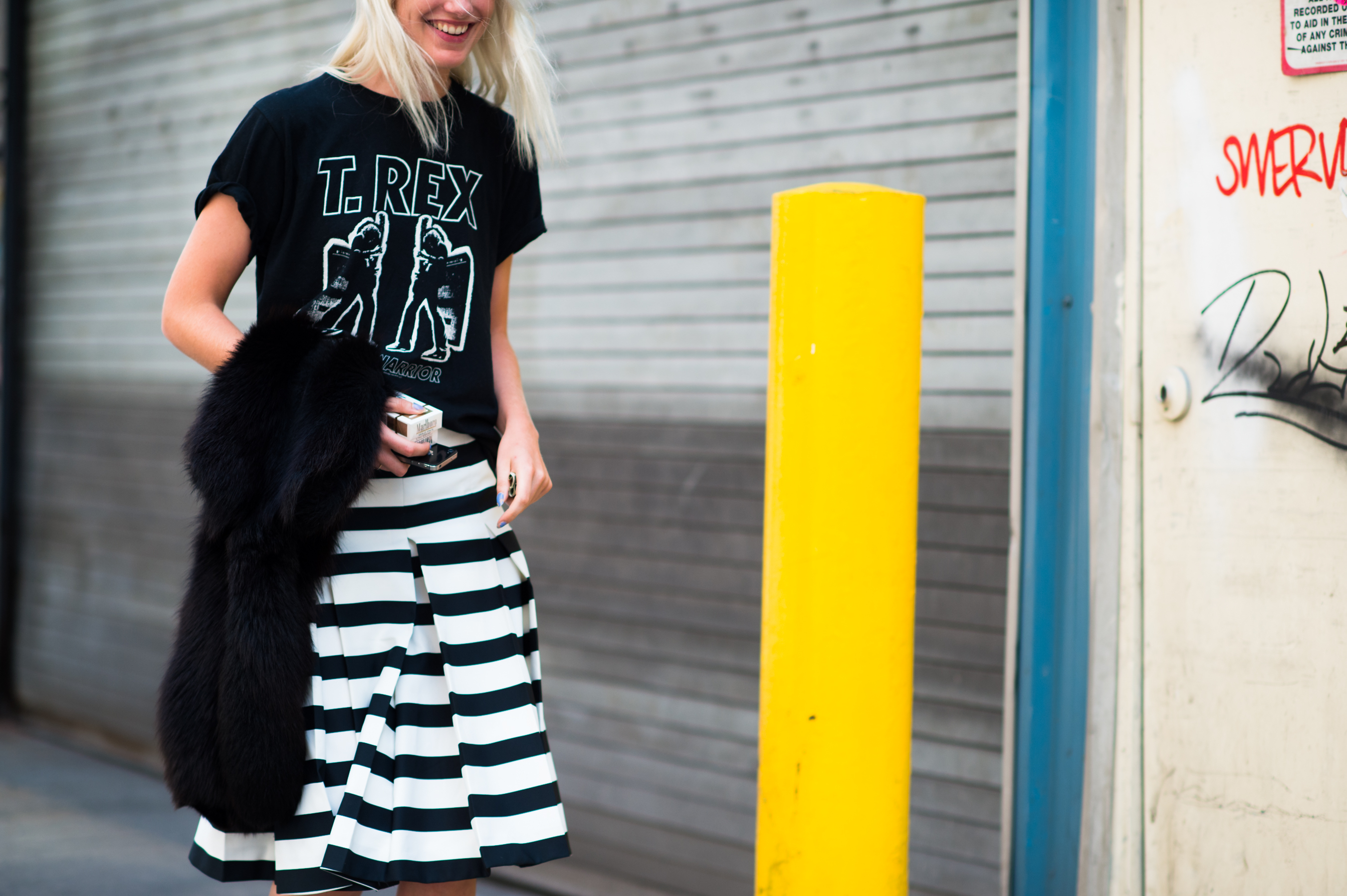 Girl wearing a T-Rex band t-shirt