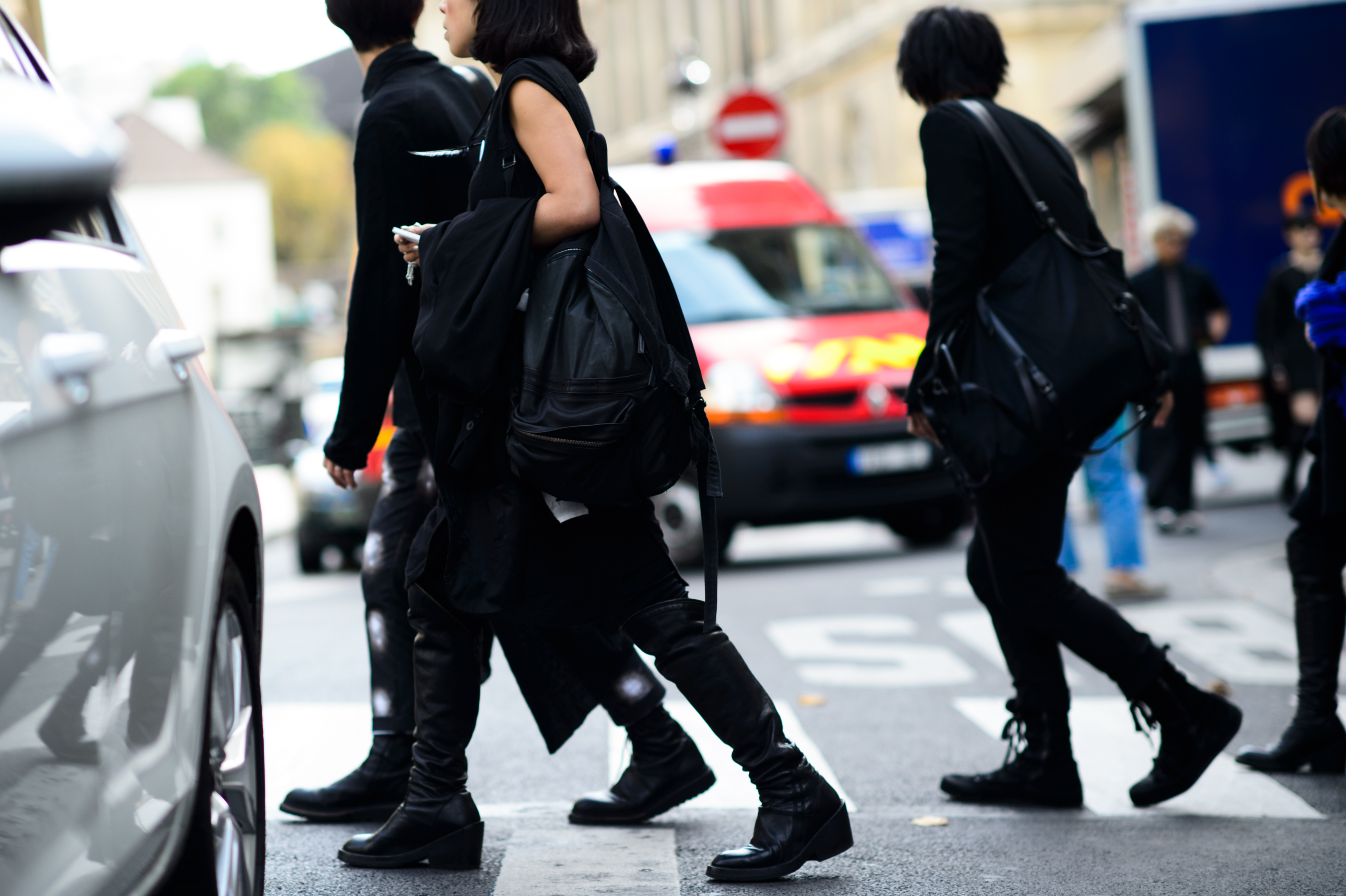 Three people wearing all black