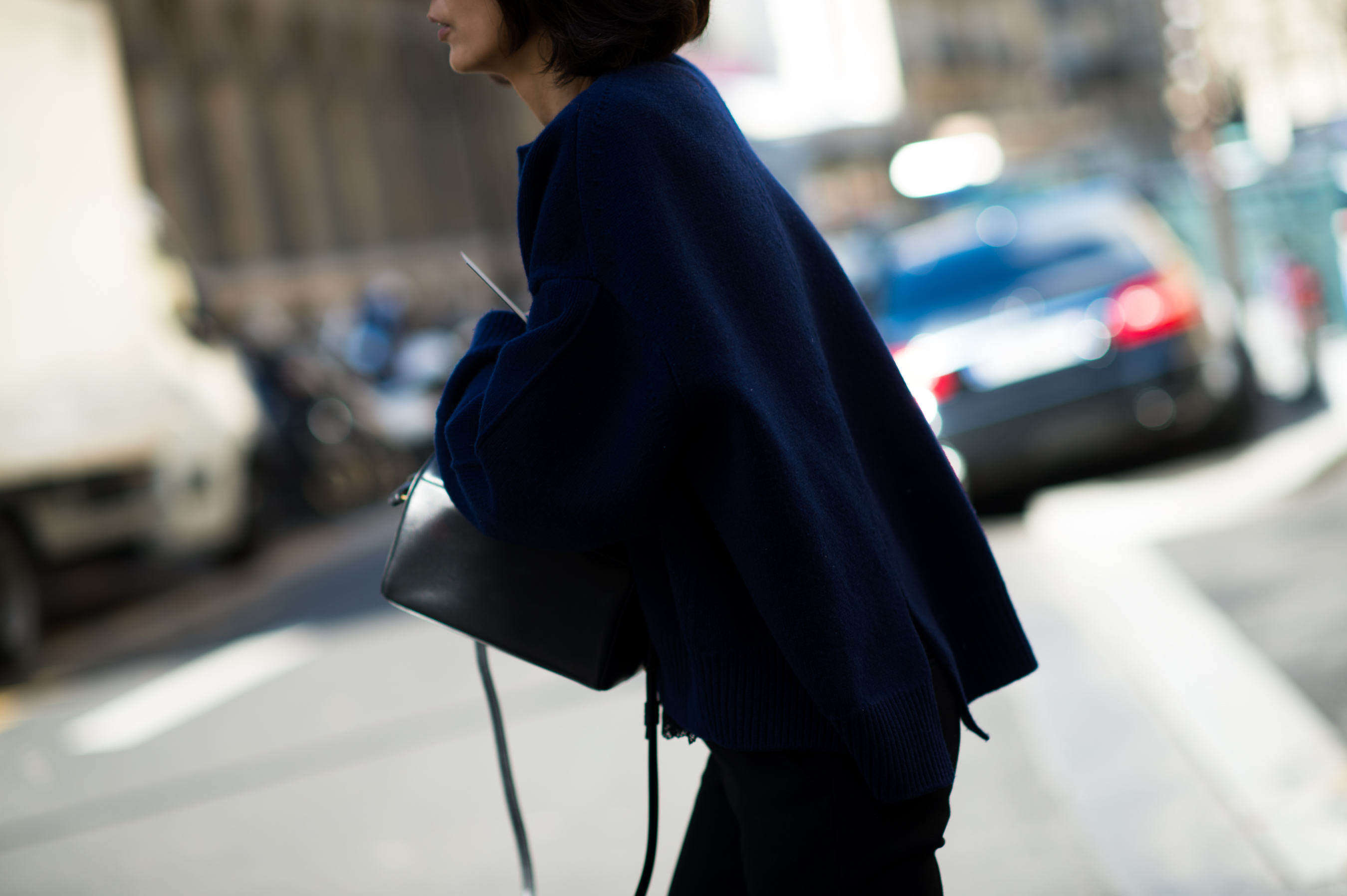 Woman wearing a navy oversized sweater