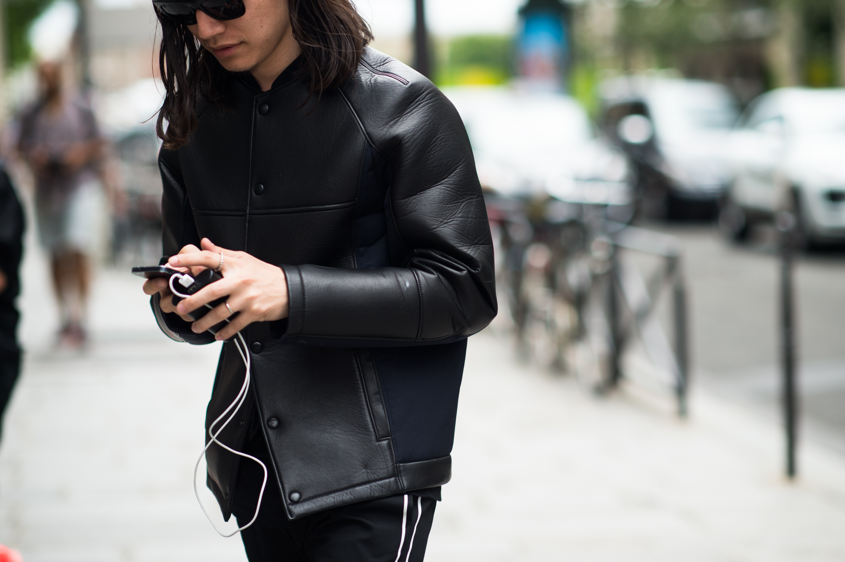 Asian man wearing a padded leather jacket