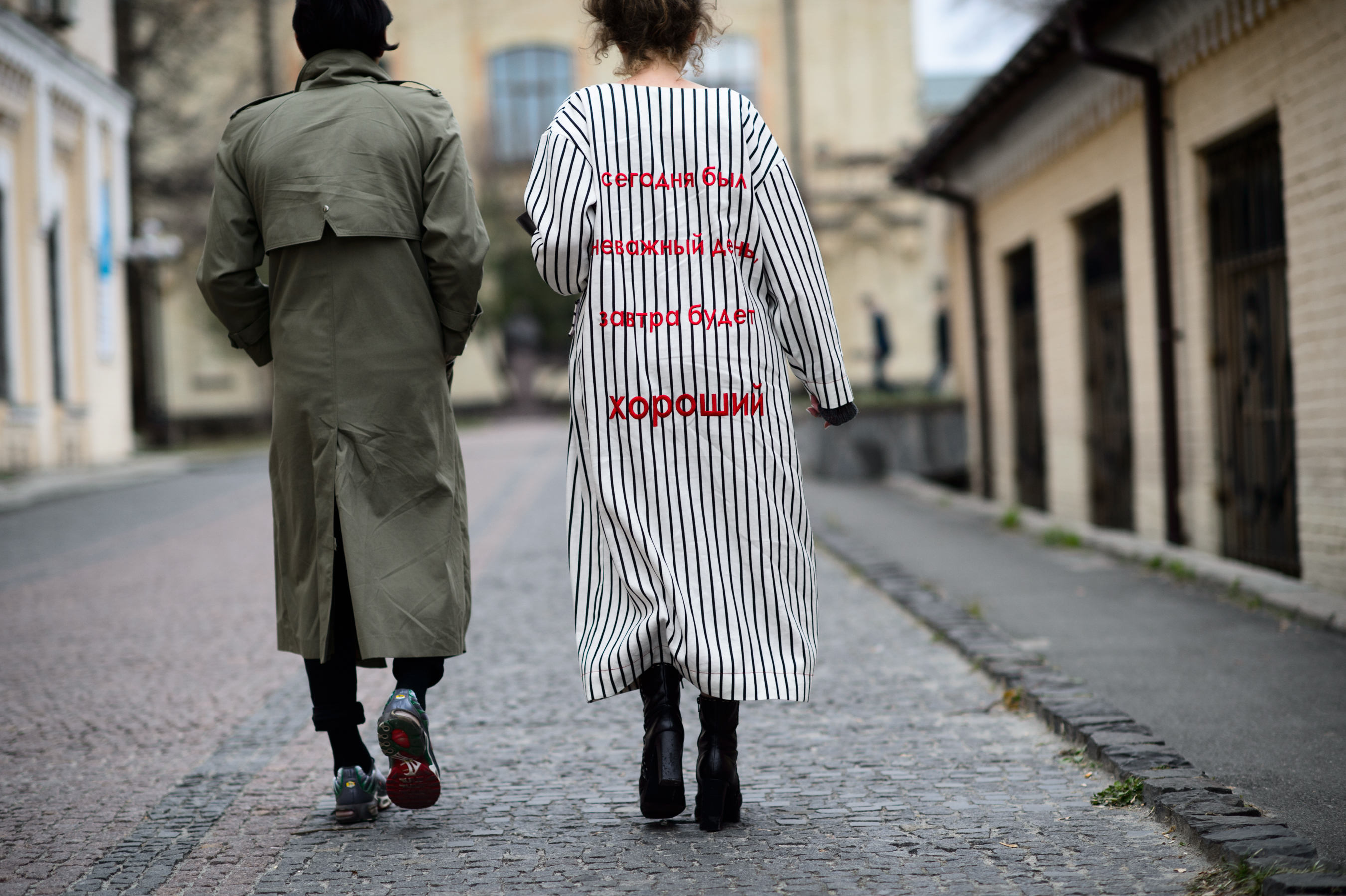 Man and woman wearing long coats